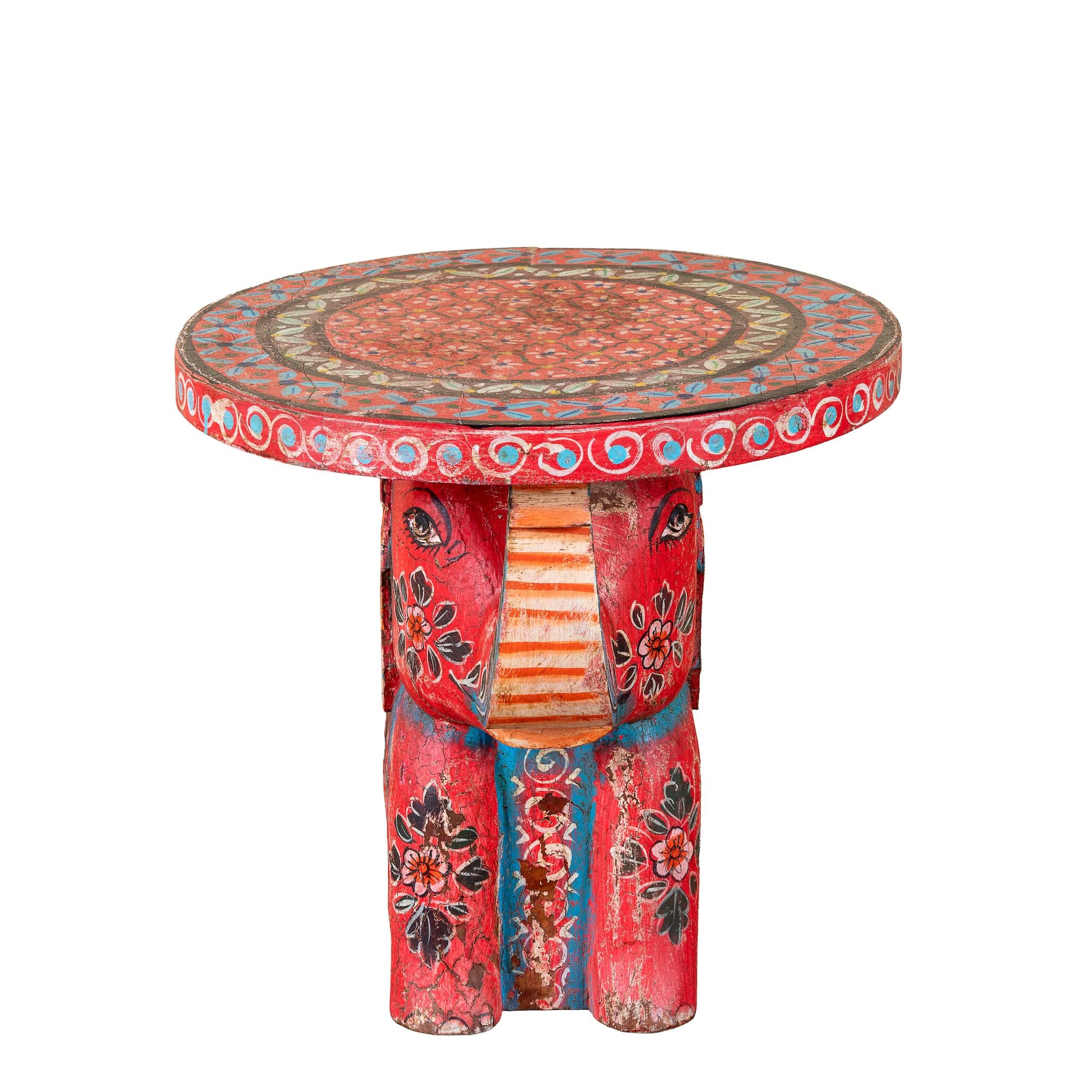 Leo hand painted solid wood elephant side table with traditional Indian artwork, available in yellow, red, and turquoise boho style designs.