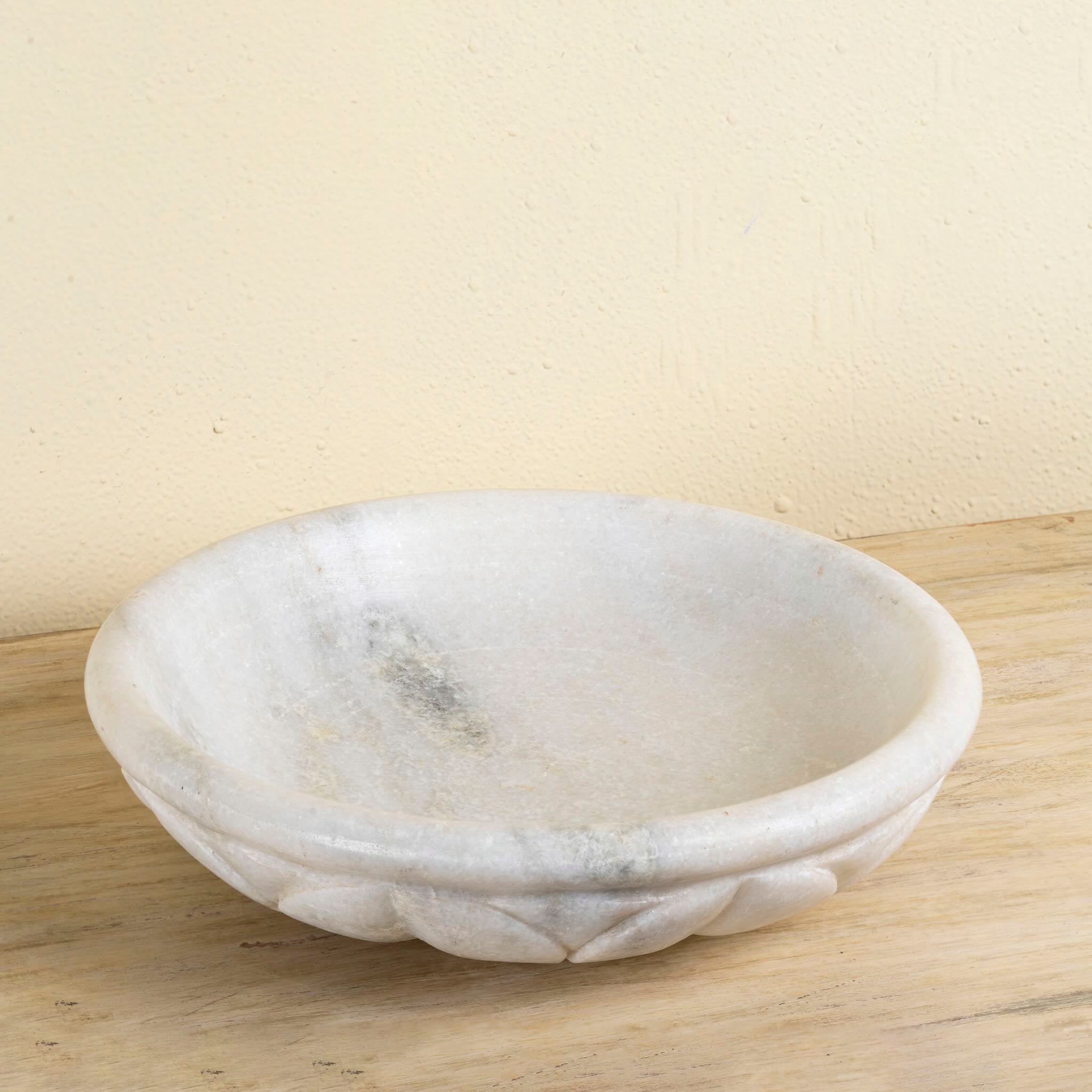 Hand-carved white marble bowl Lotus with lotus flower design. A vintage home accessory perfect for styling in vintage home decor with natural stone craftsmanship and soft grey veining.