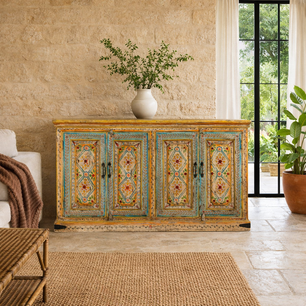 Lifestyle imagination of a hand painted wooden dresser with floral and geometric motifs, reclaimed wood living room furniture in vintage boho style, 170 × 45 × 95 cm.