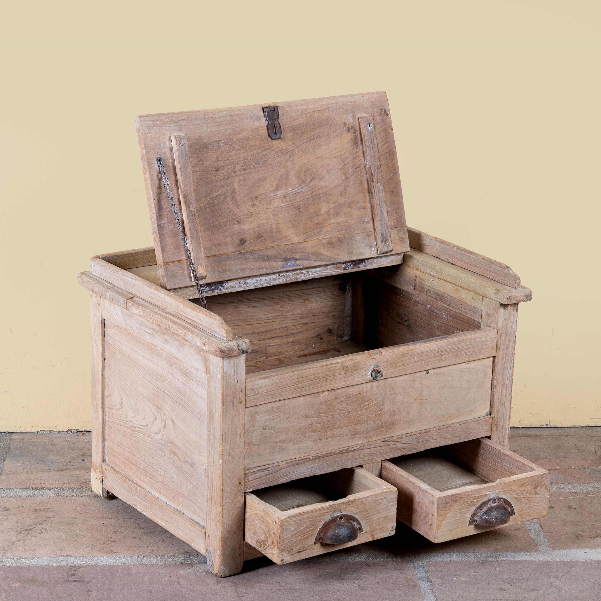 Side angle image with open lid of a Mivaan vintage reclaimed teak wood box with writing lid, small drawers, and restored rustic teak finish.