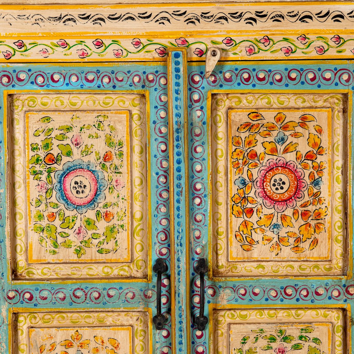 Close up image of a Nehrika hand painted reclaimed wood cabinet with colourful floral double doors and three storage compartments, 150cm