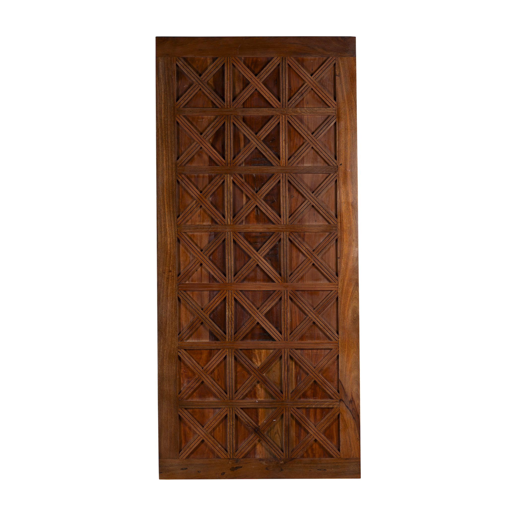 Wooden door with geometric lattice design on a white background