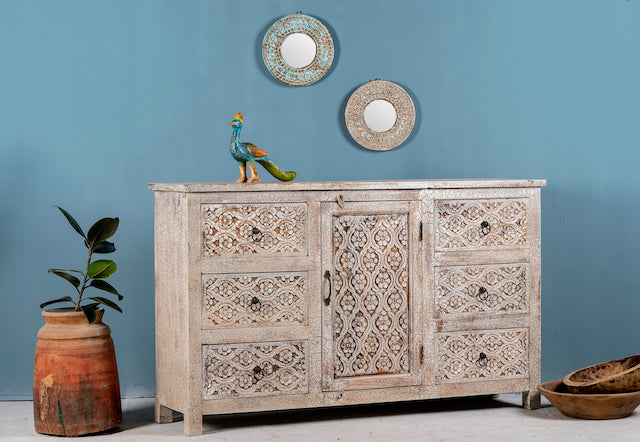 Side angle image of a vintage mango wood furniture sideboard with hand-carved details and distressed style finish, 150 × 40 × 90 cm.