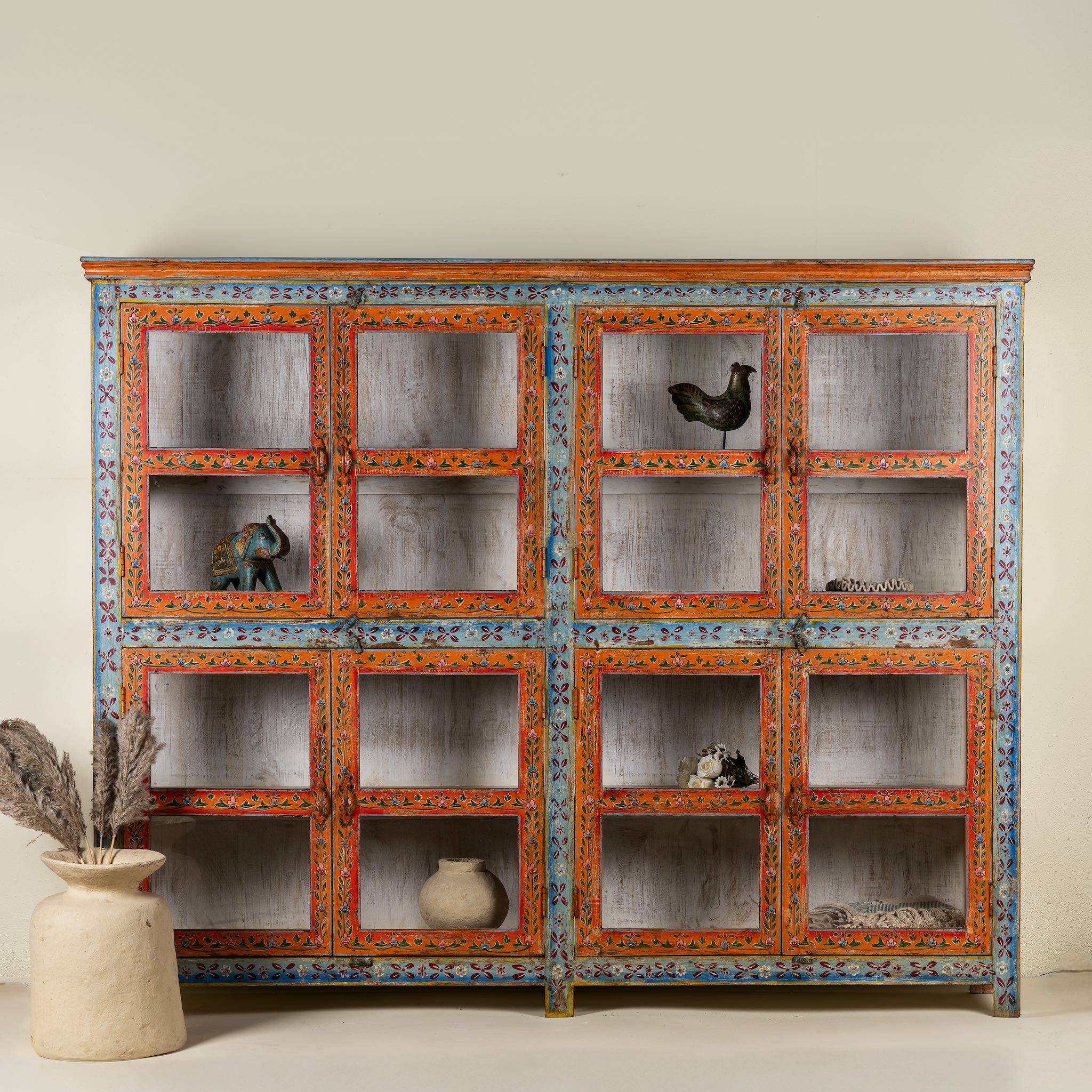 Hand-painted reclaimed wood showcase cabinet with Ibiza-style motifs, glass-panelled doors, unique wooden furniture for living room, 213 × 40 × 170 cm.