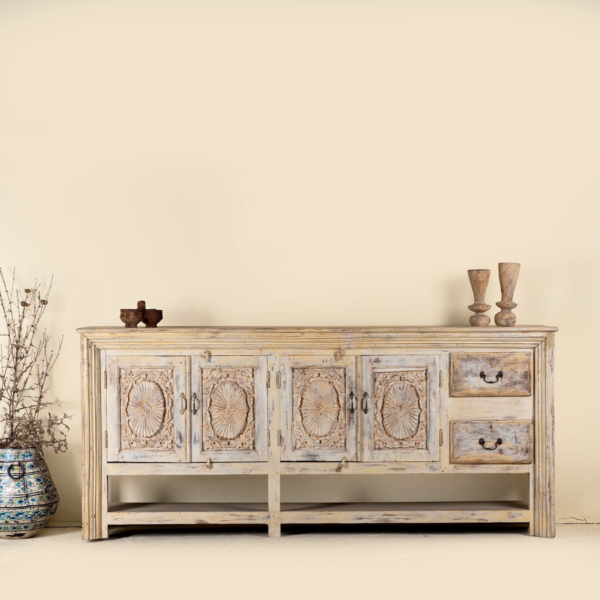 Vintage console table made from reclaimed wood with carved teak front, two drawers, four cupboards, and lower shelf, 201 × 42 × 100 cm.