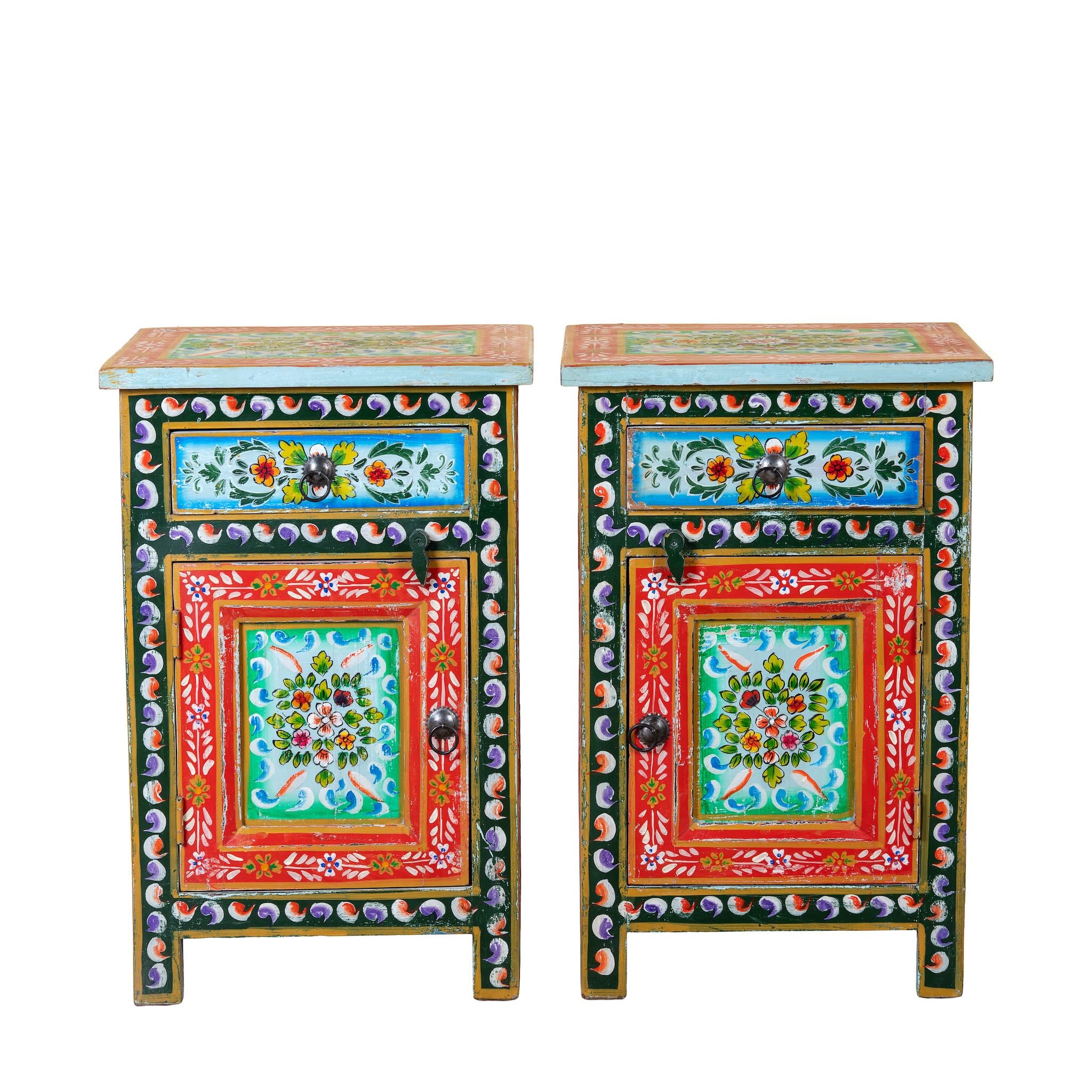 White background image of a hand-painted bedside table made from recycled wood – vintage night stands with carved mango wood furniture detailing and floral artistry.