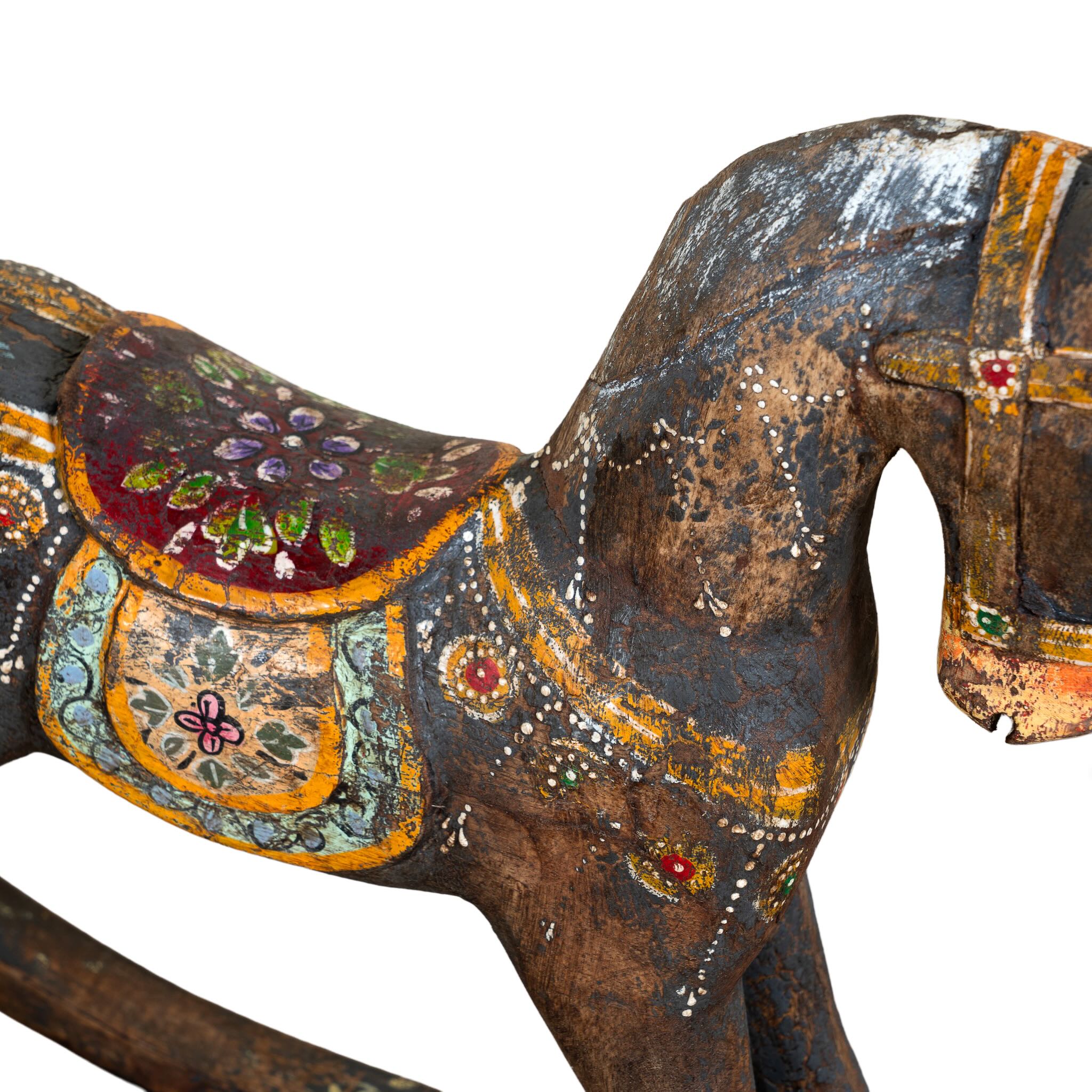 Colourful hand-painted wooden rocking horses with ornate saddle patterns, crafted in India. Unique bohemian interior décor accents made from solid wood, perfect for shelves or sideboards.