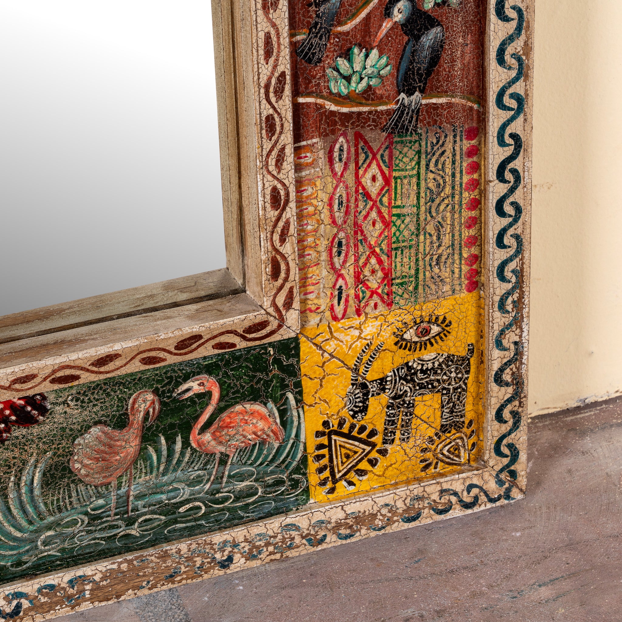 Close up image of a Rudransh hand-painted reclaimed wood wall mirror featuring colourful Indian folk art panels with wildlife and botanical motifs, 90x90x5cm.