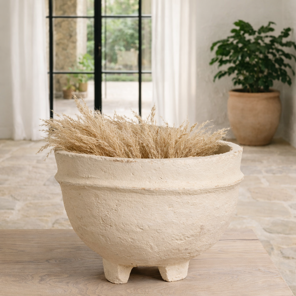 Lifestyle image with a of a handmade papier-mâché bowl Pranshi in a soft matte finish with rounded shape and feet. A vintage home accessory and unique Indian decoration ideal for vintage home decor, bathrooms, kitchens, or dried plants.