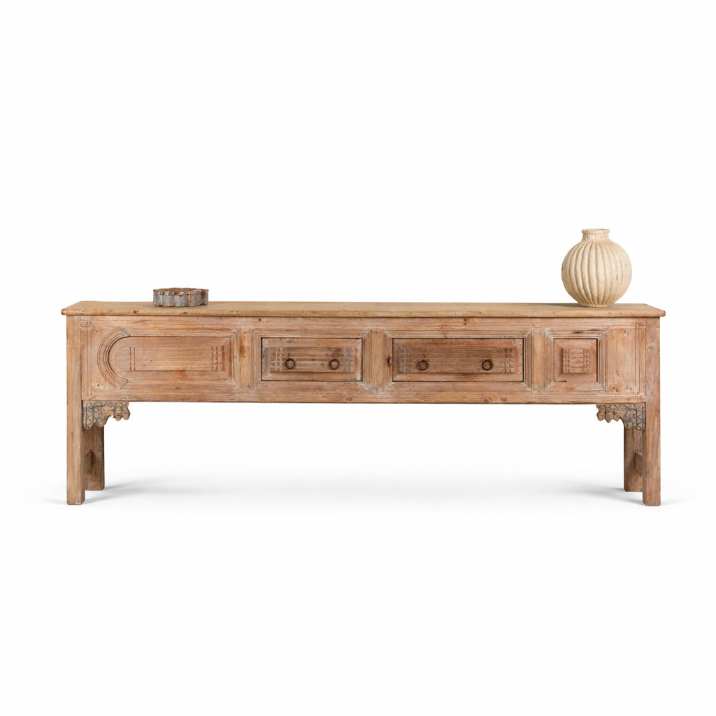 White background image of a Akhilesh carved console table made from reclaimed teak, a striking piece of unique wooden furniture.