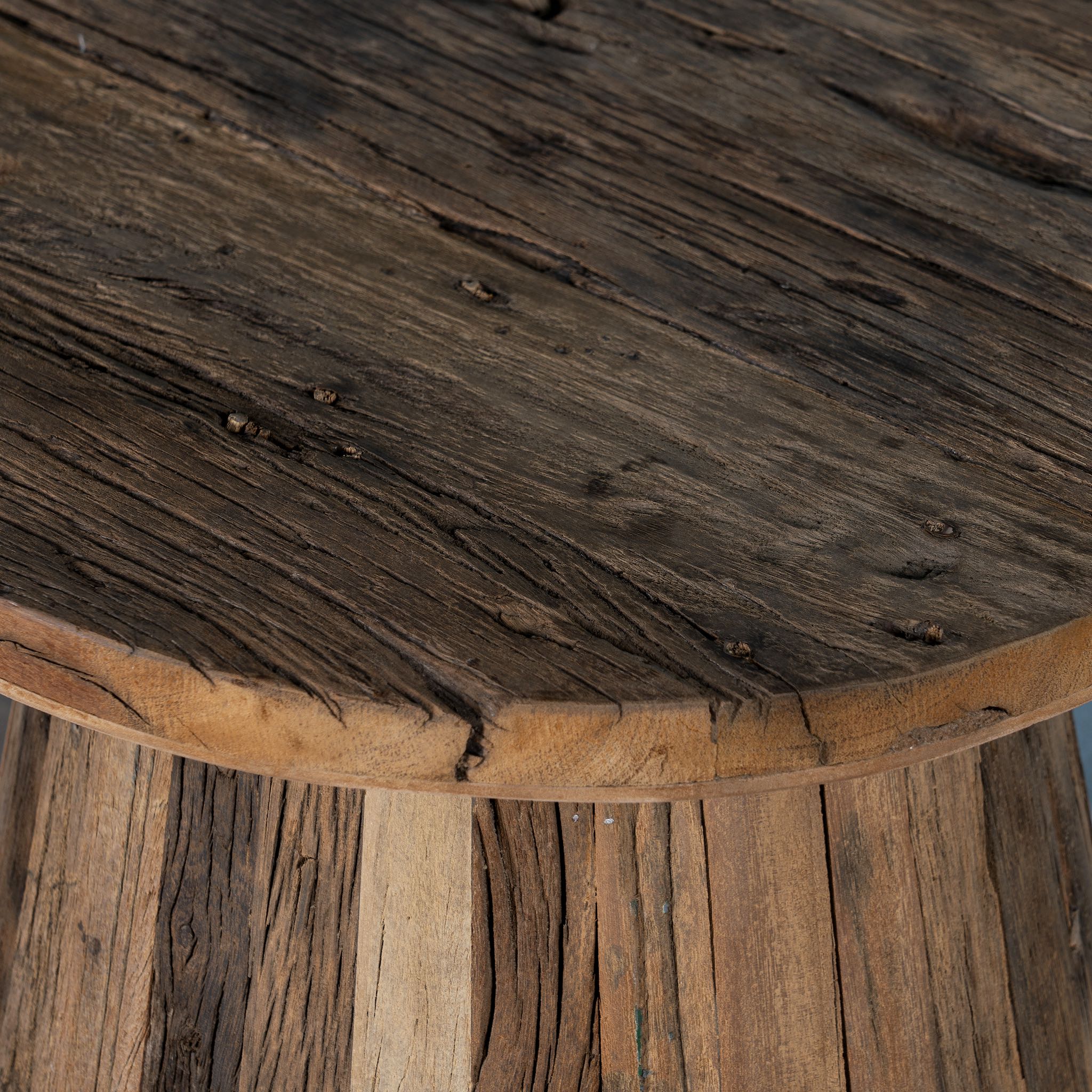 Close up image of a sustainable driftwood coffee table with conical base, handcrafted from reclaimed wood with rustic minimalism, 45 × 54 cm.