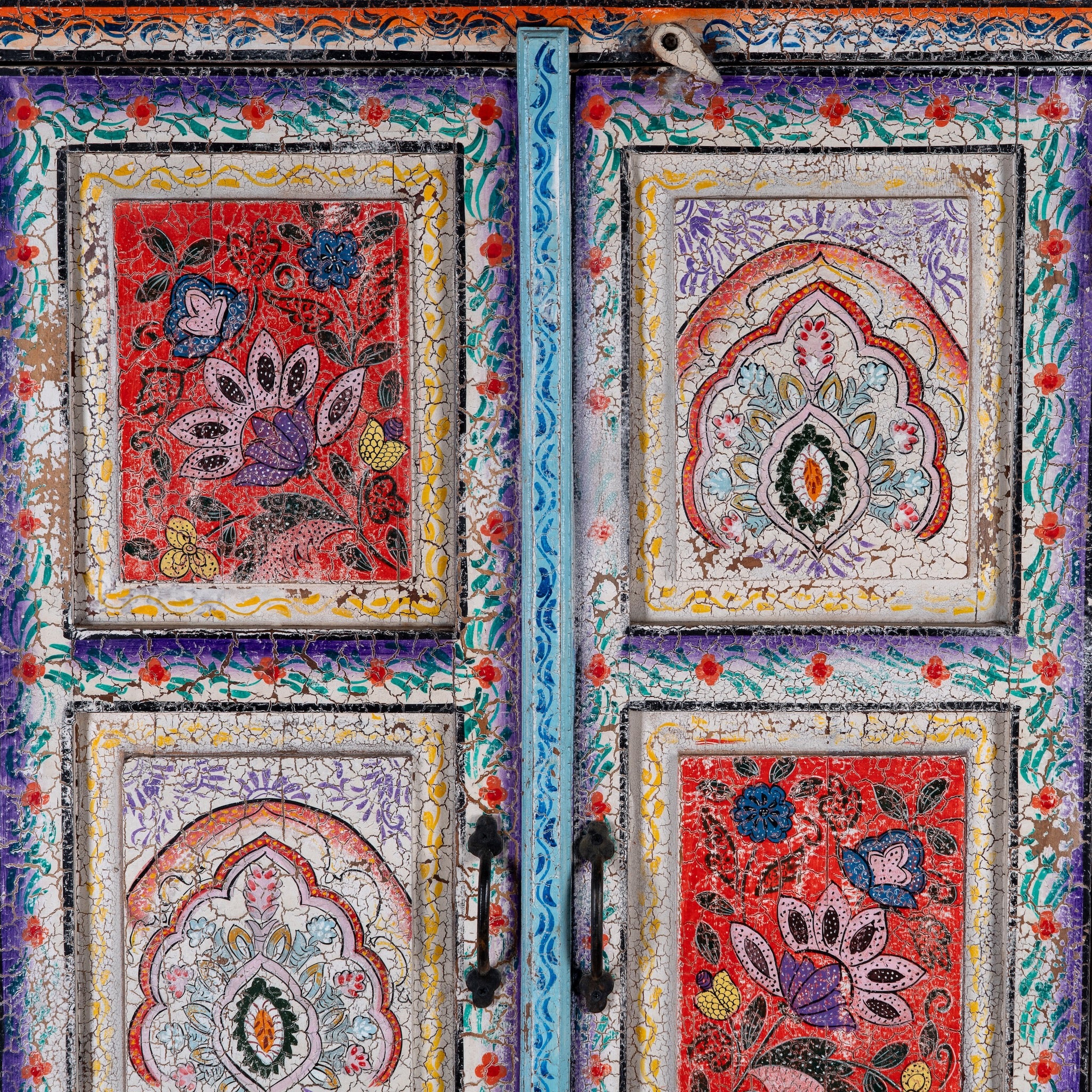 Close up image of a Saya hand painted reclaimed wood cabinet with colourful Indian artwork 180cm
