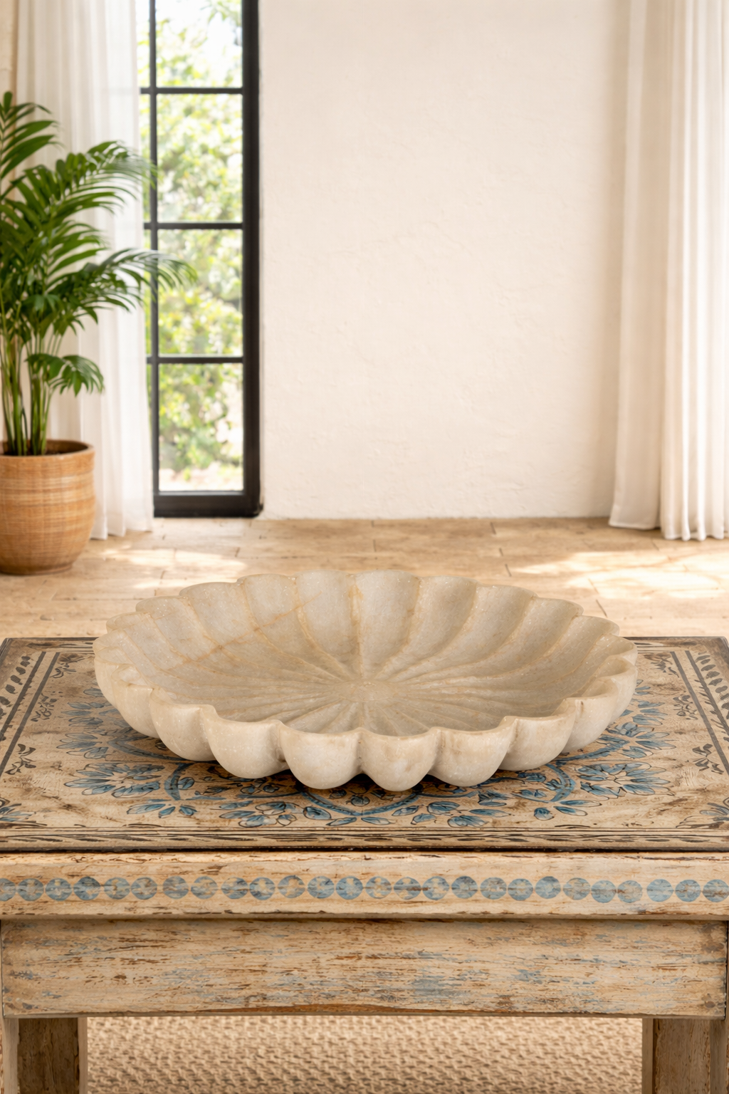 Lifestyle imagination of a hand-carved white marble plate with floral petal design, ideal for Indian home decor and vintage home decoration.
