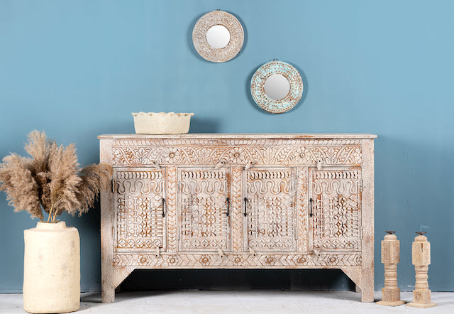 Hand-carved mango wood sideboard with a three-layer vintage finish, featuring two doors and three drawers—perfect for rustic or bohemian interiors.