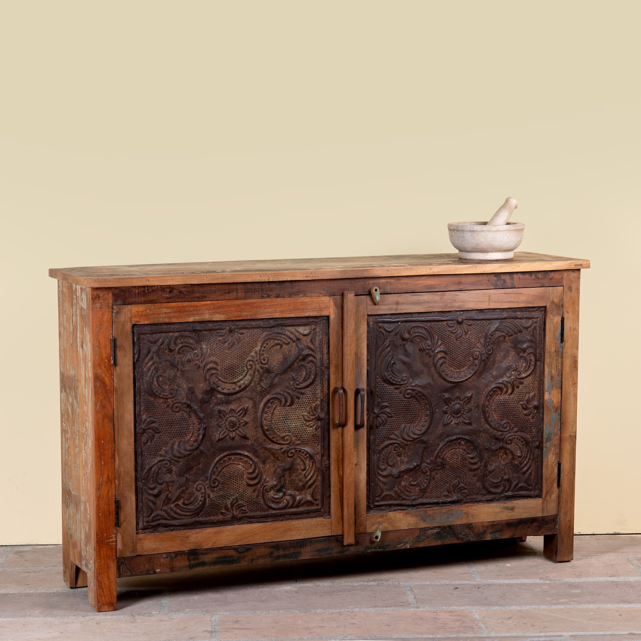 Side angle image of a Sitara reclaimed wood sideboard with antique Indian iron ceiling panel doors 155cm