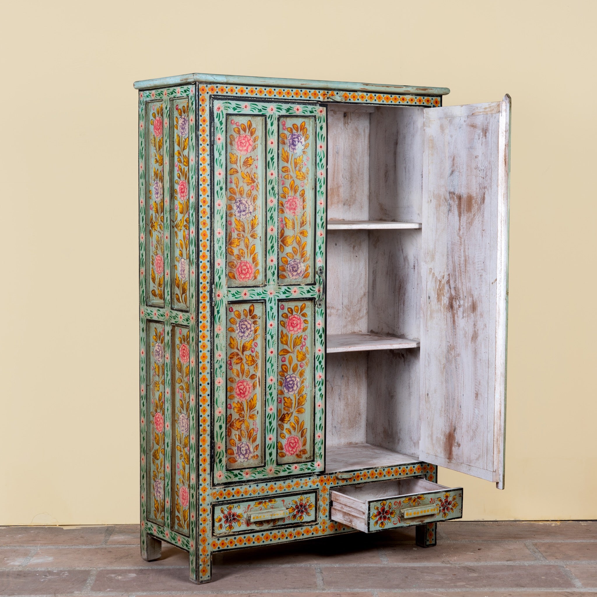 Side angle image with open door of a Siyan hand painted reclaimed wood Boho cabinet with floral motifs 152cm