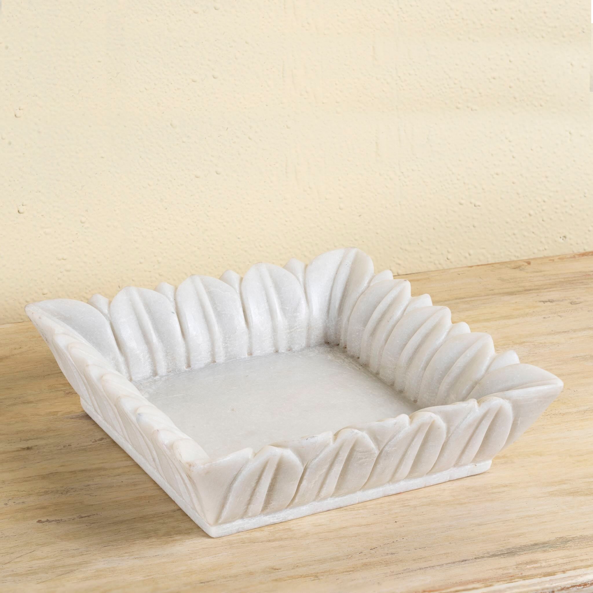 Square hand-carved white marble bowl with petal-like edges – decorative Indian marble accessory.
