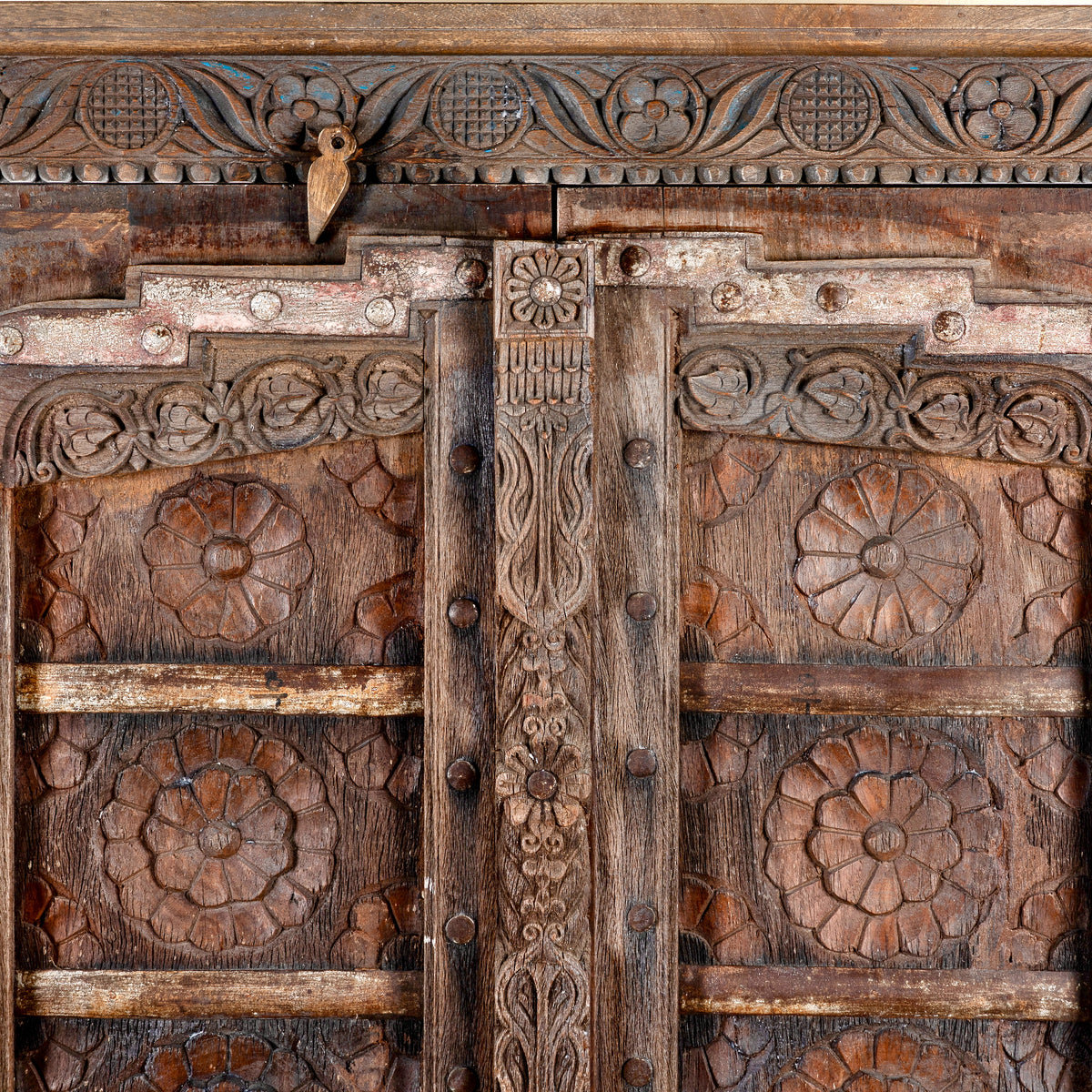 Close up image of a Srinika vintage Indian wardrobe with mango wood body and old hand-carved teak house door, 94x42x195cm
