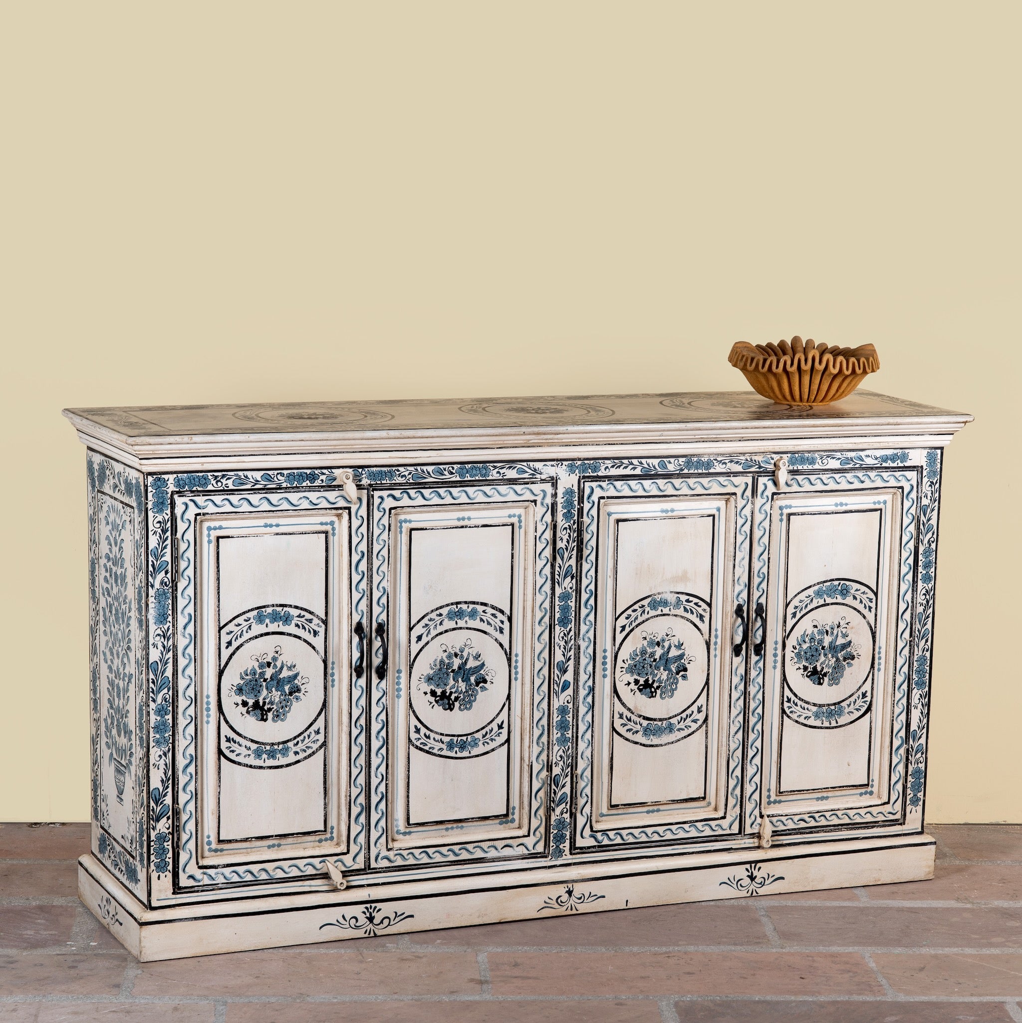 Side angle image of a Suchi limited edition reclaimed wood sideboard with Delft inspired hand painted motifs 170cm
