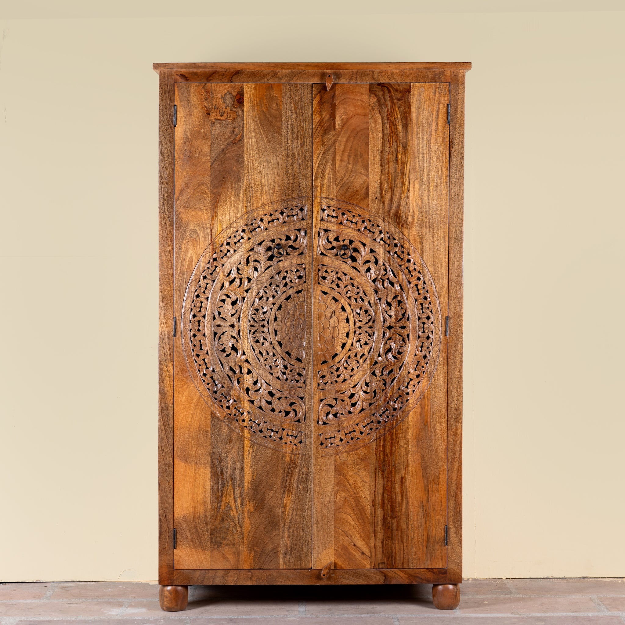 Tash hand carved mango wood wardrobe with mandala carved doors, hanging rail and four storage compartments, 108x55x190cm
