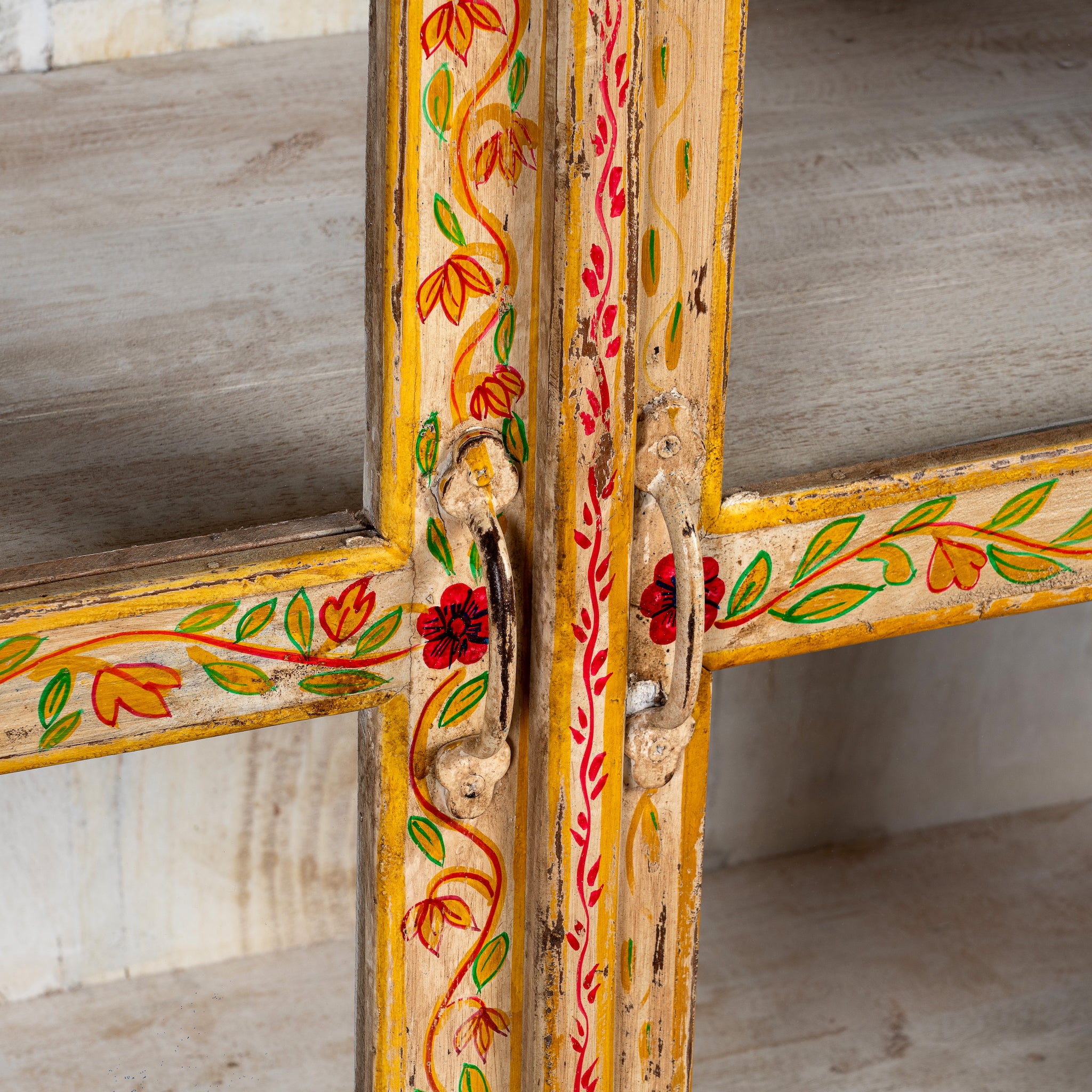 Close up image of a Tushar hand-painted reclaimed wood display cabinet with colourful floral design and two doors 122cm