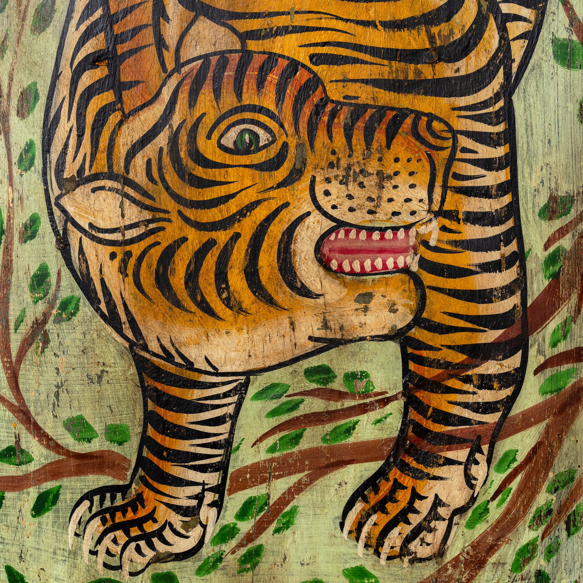 Close up image of a hand-painted Indian teak wall panel featuring a vibrant tiger motif on reclaimed antique wood, handcrafted by artisans in Rajasthan for unique cultural wall décor.