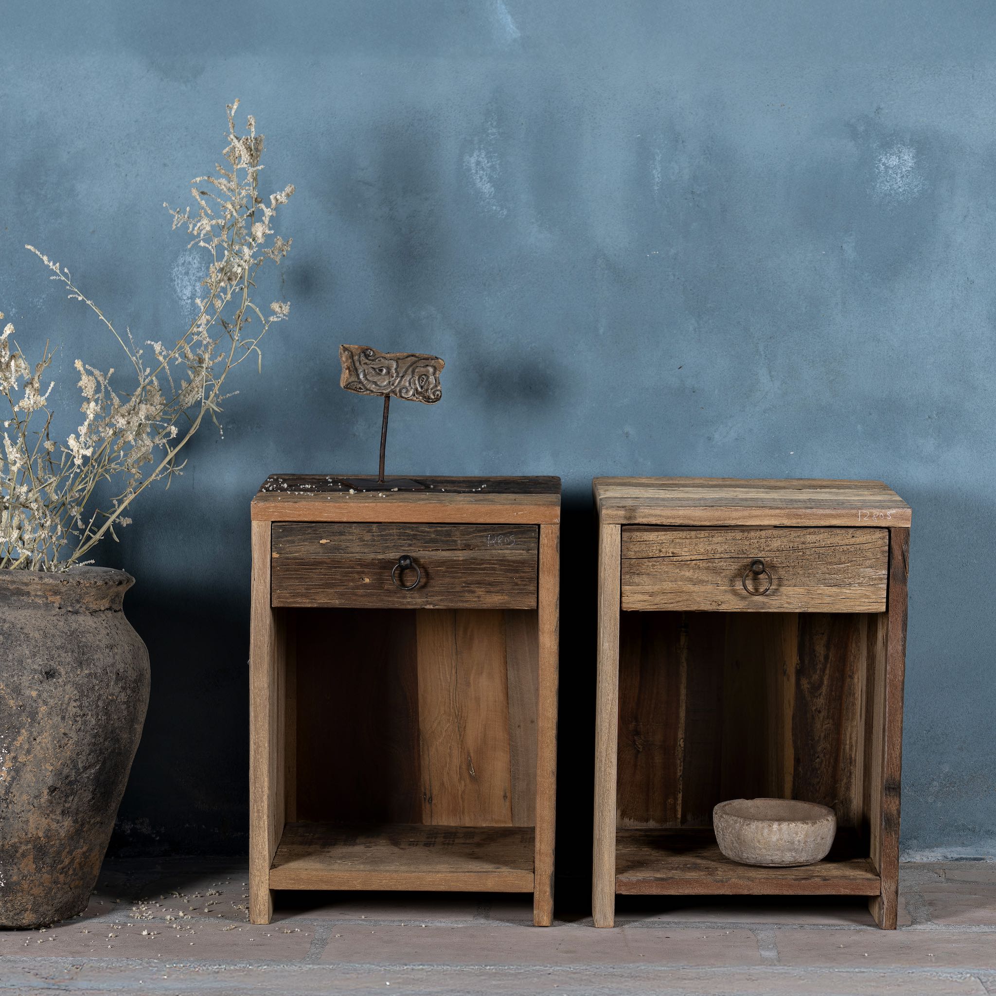 Front view image of a reclaimed wood bedside table with drawer and open shelf – handcrafted driftwood furniture designed for rustic minimalism and natural interiors.