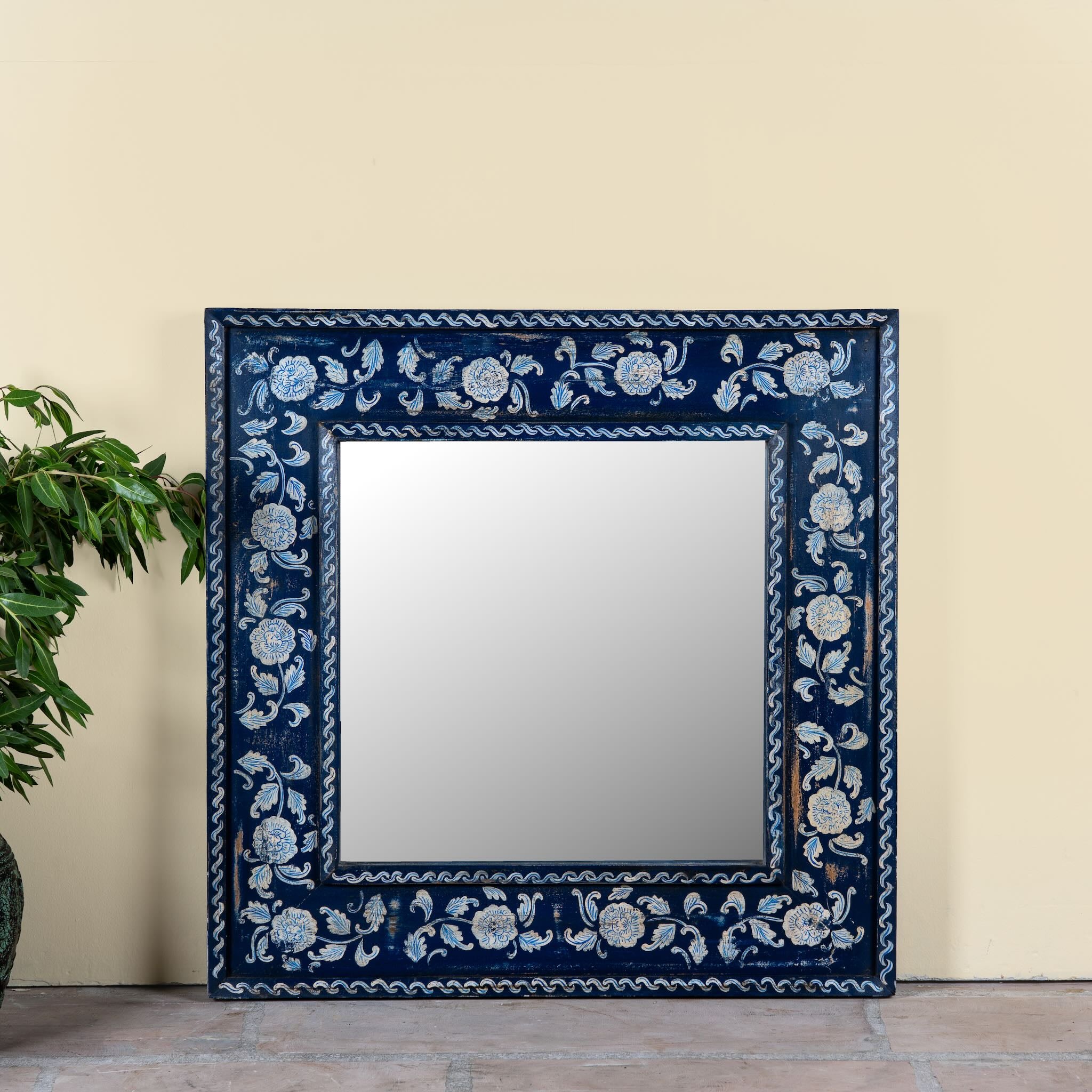 Vihana hand-painted reclaimed wood wall mirror with deep blue floral frame, artisan detailing, and vintage Indian character, 90x90cm.