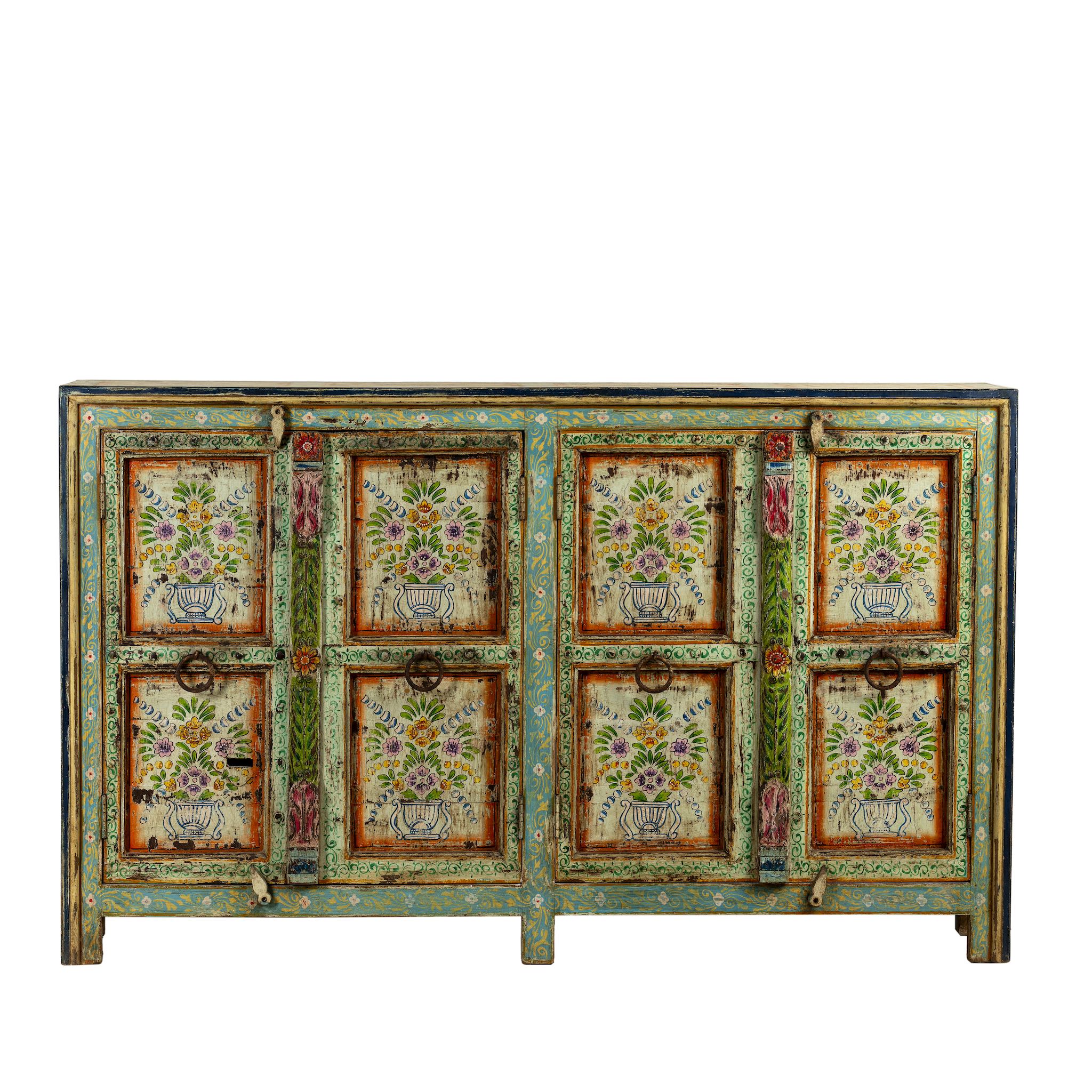 White background image of a reclaimed wood sideboard with hand painted floral motifs and distressed finish; artisanal storage furniture for bohemian interiors, 170 × 40 × 104 cm.