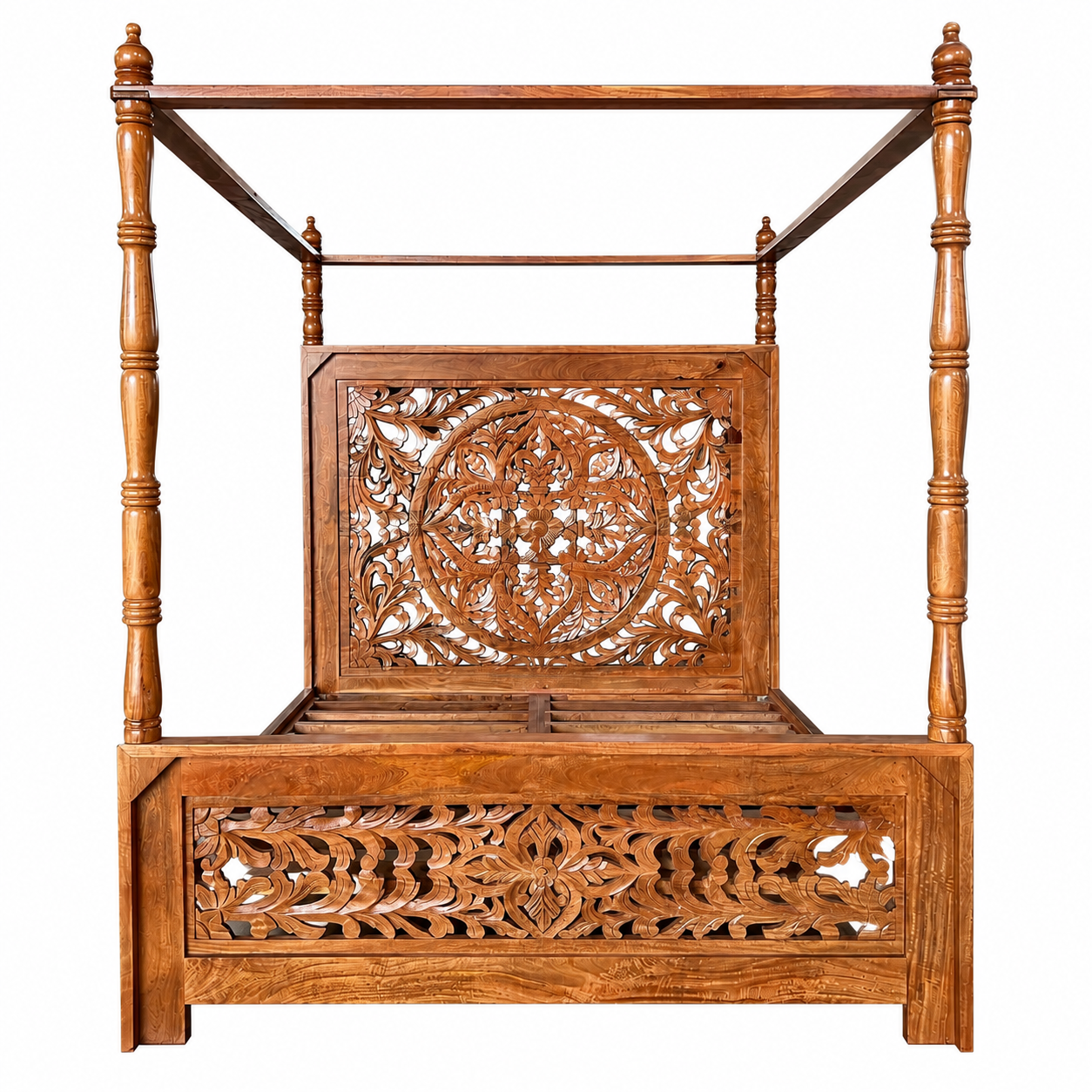 A traditional wooden canopy bed with intricate hand-carved floral and geometric patterns on the headboard and footboard, shown against a plain white background.