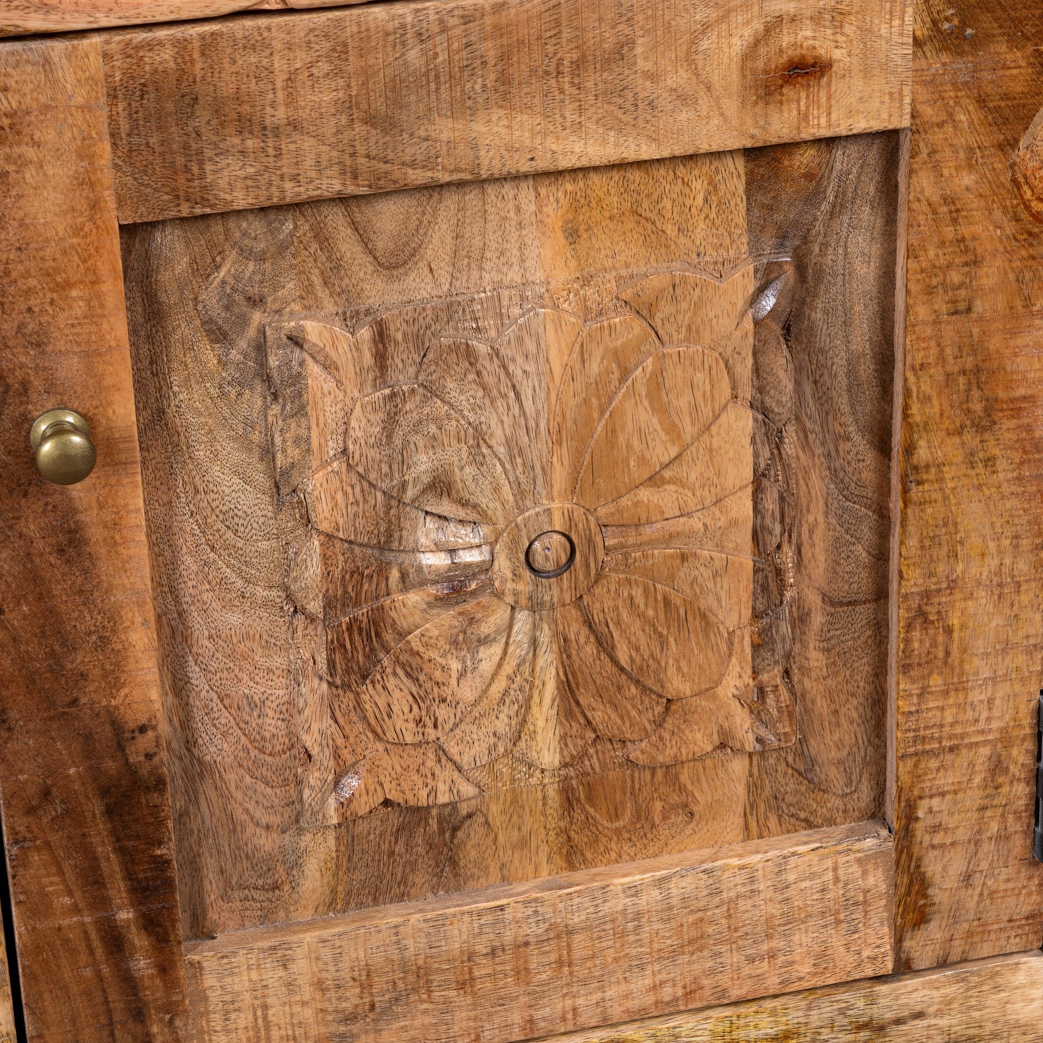 Close up image of a Yana set of two hand carved mango wood bedside tables with drawer and cupboard 65cm