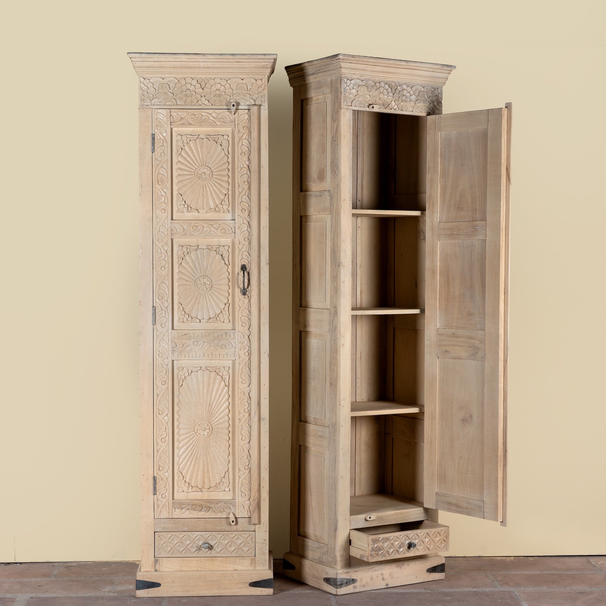 Side angle image with open door of a Zaina hand carved bleached reclaimed wood cabinet with floral carved doors 221cm