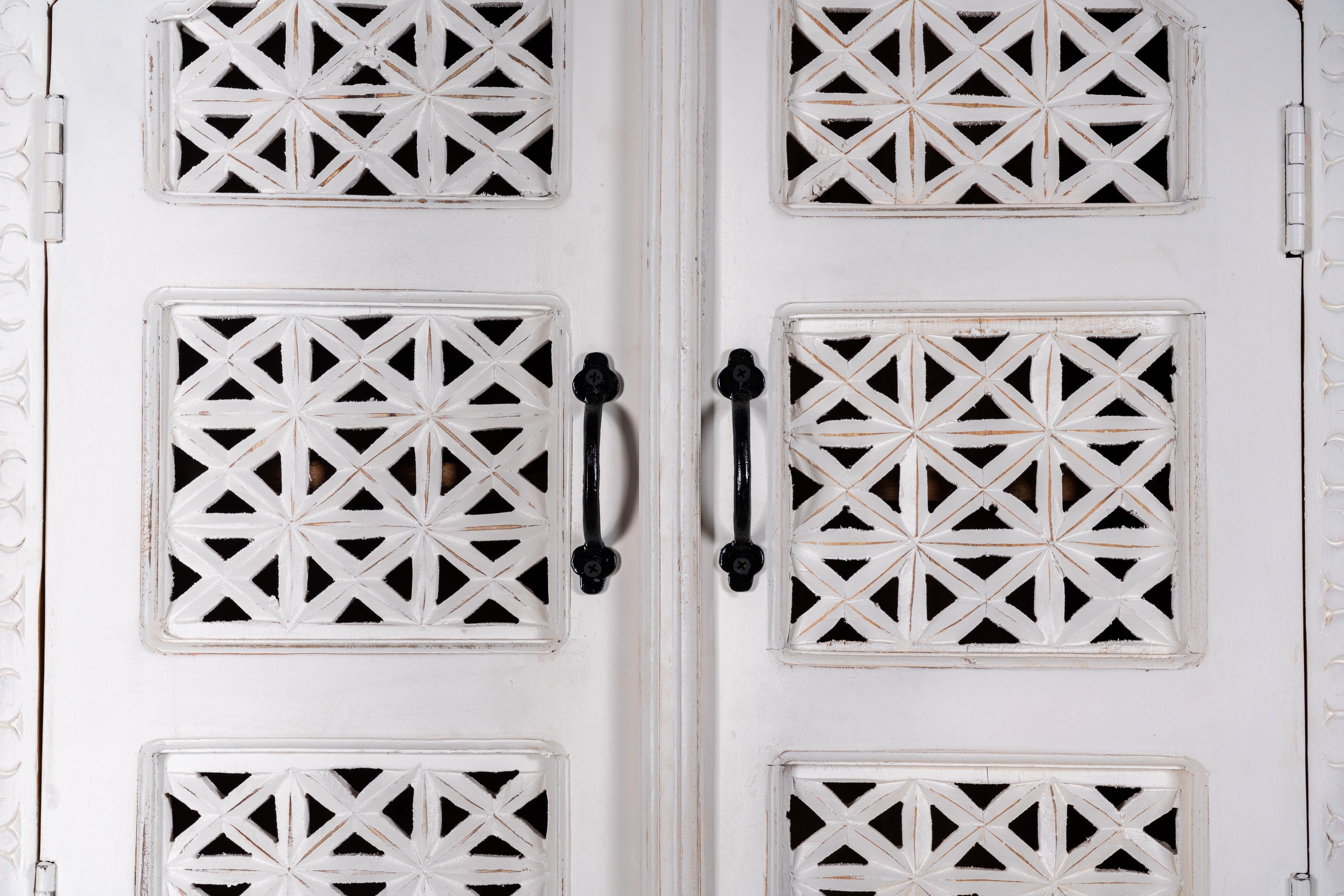 Close up image of a Aesha white washed mango wood cabinet with Oriental hand carved doors 180cm