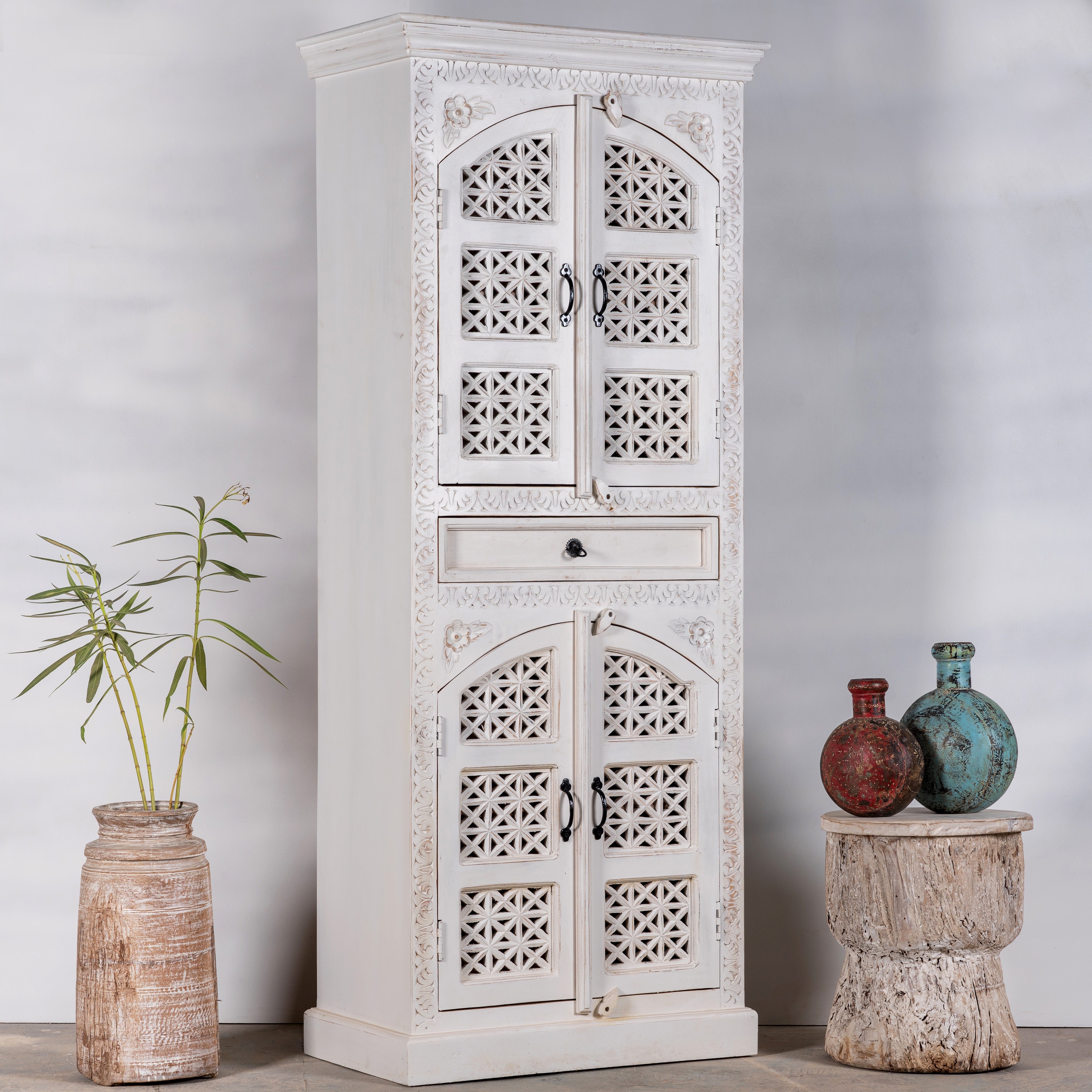Side angle image of a Aesha white washed mango wood cabinet with Oriental hand carved doors 180cm