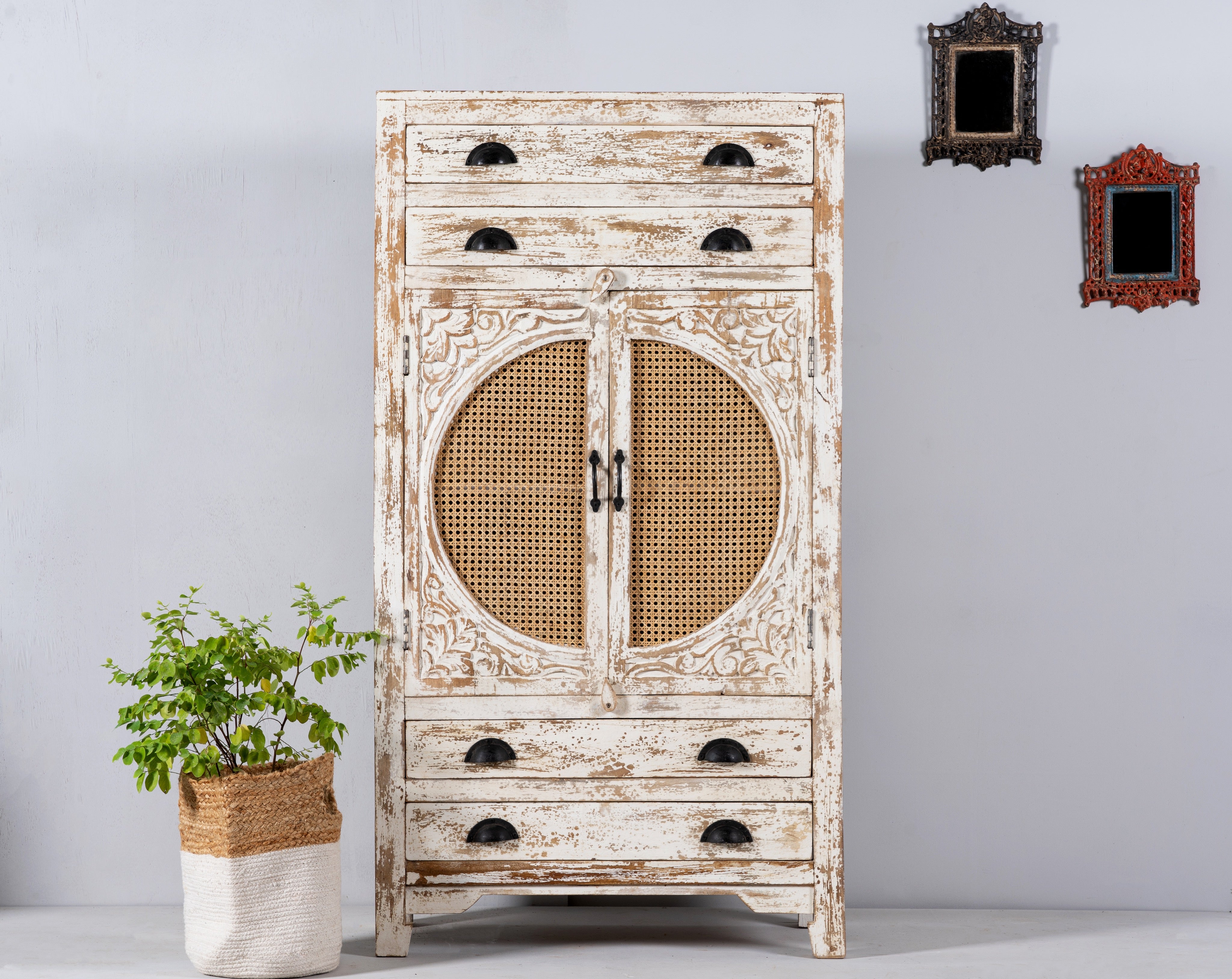 Ahalya handcrafted solid mango wood cabinet with hand-carved floral doors, natural rattan inserts, four drawers, two storage compartments, and Mediterranean-inspired design, 148cm.