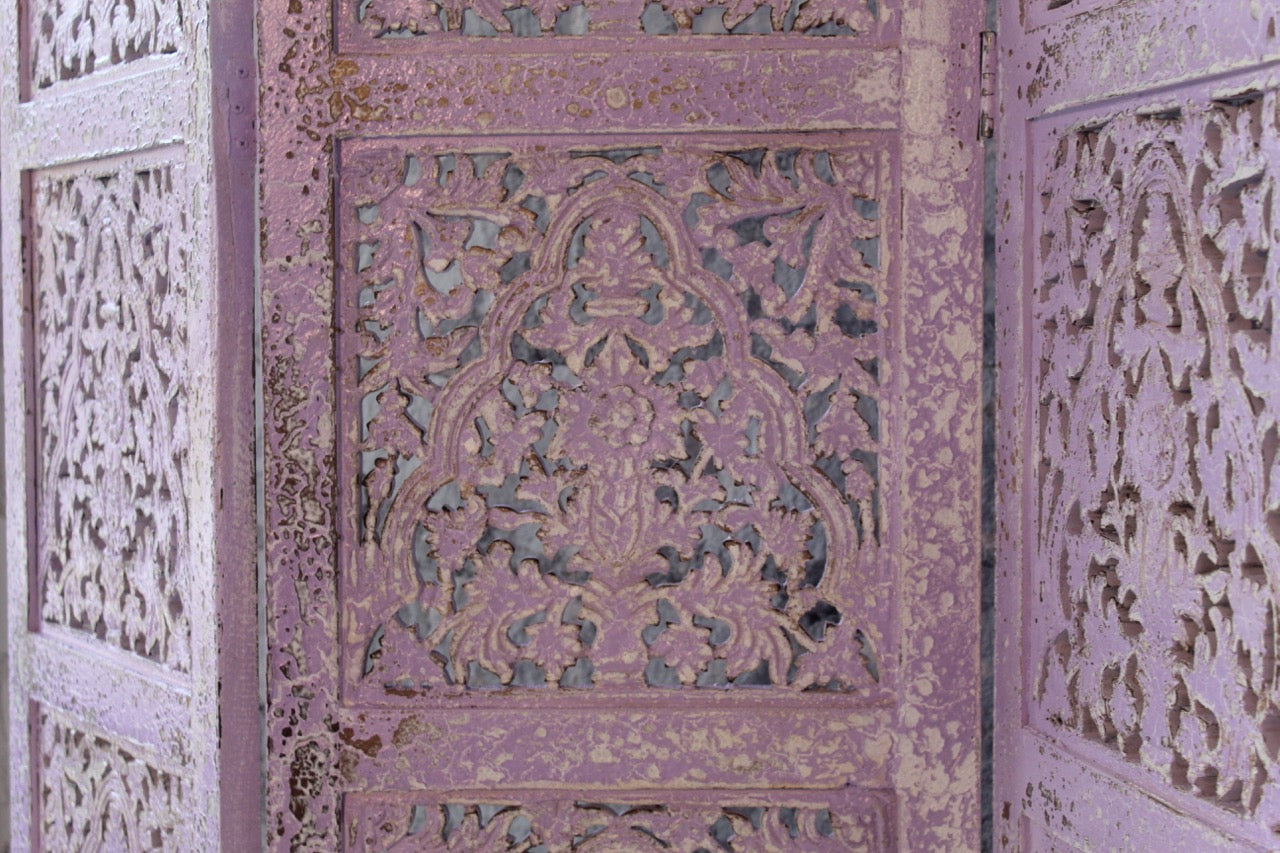 Close up image of a Alag Violet hand carved mango wood folding room divider with decorative carved panels 180cm