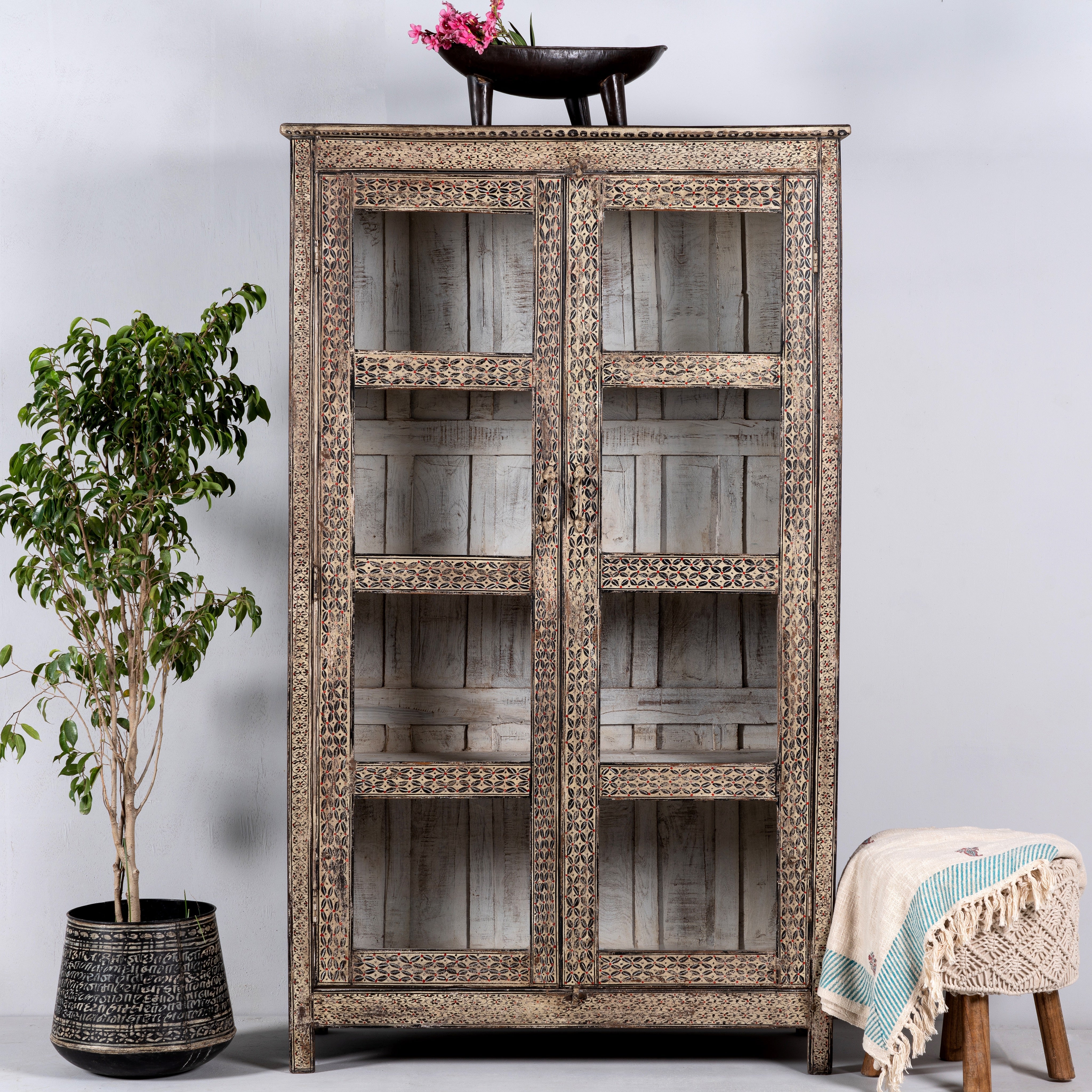 Handcrafted reclaimed teak wood display cabinet with glass doors and hand-painted Sanskrit symbols – sustainable furniture with vintage soul and artisanal charm.
