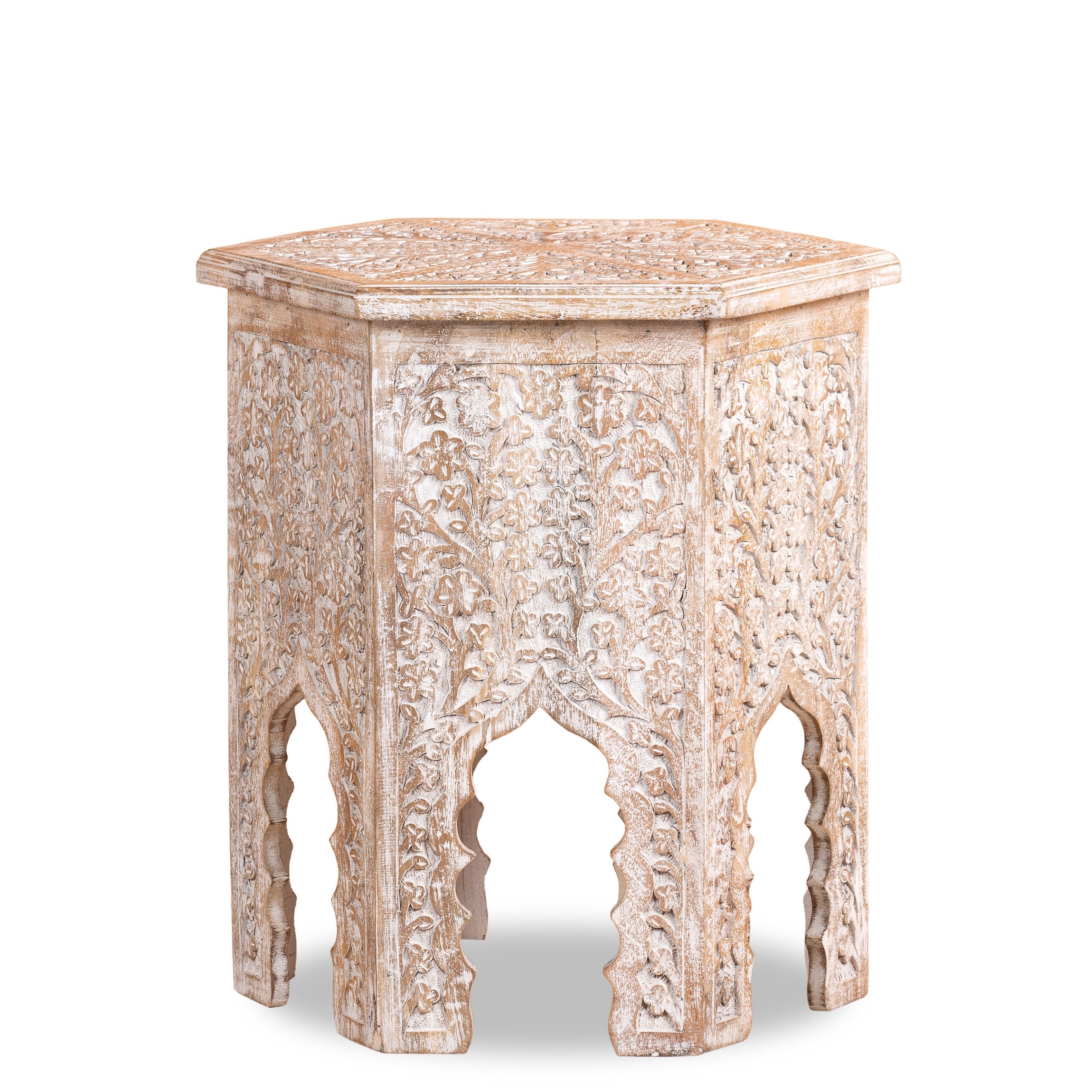 White background image of a hand carved white washed vintage coffee table with floral motif.