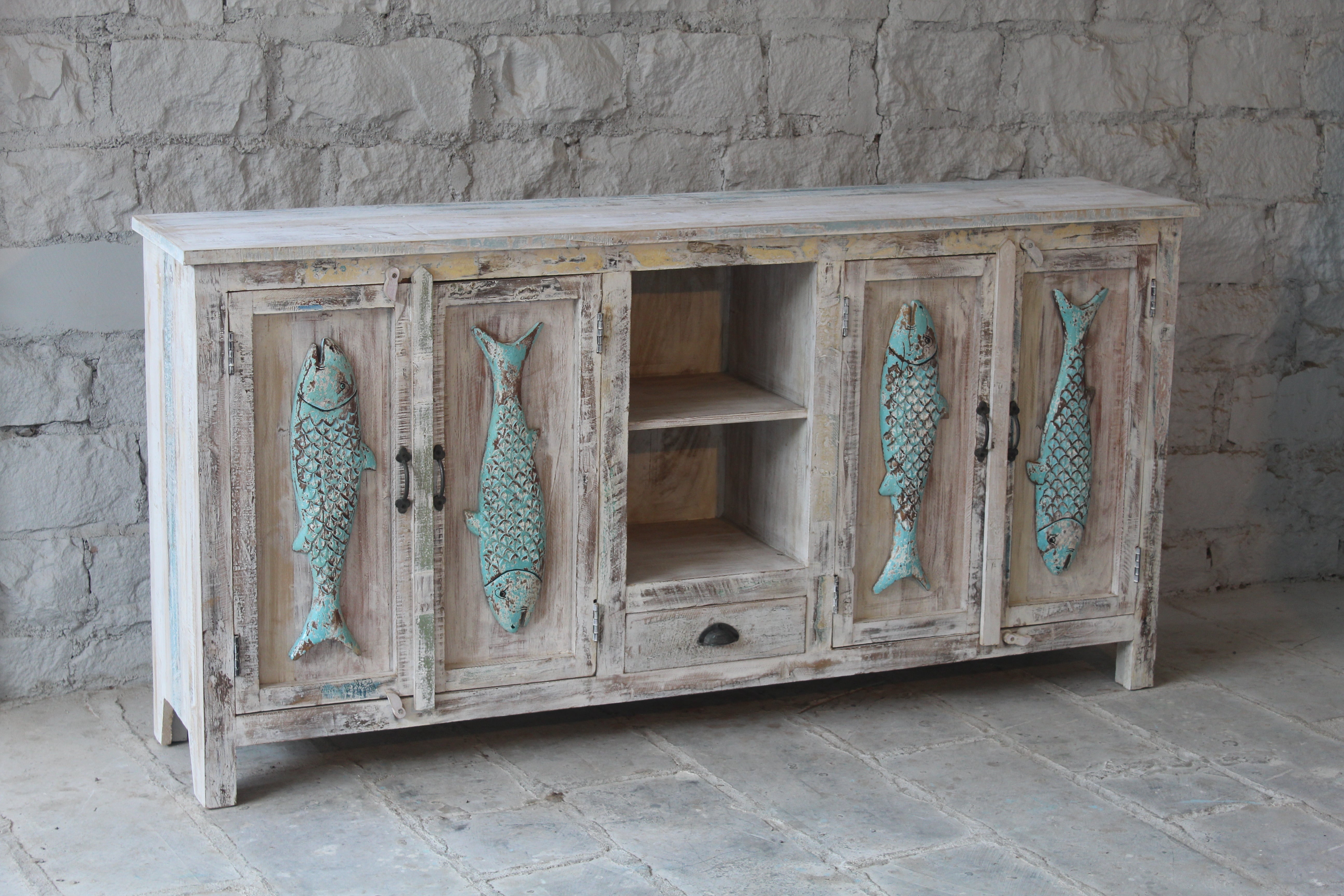 Side angle image of a Jhund hand carved mango wood sideboard with blue fish motif doors 184cm