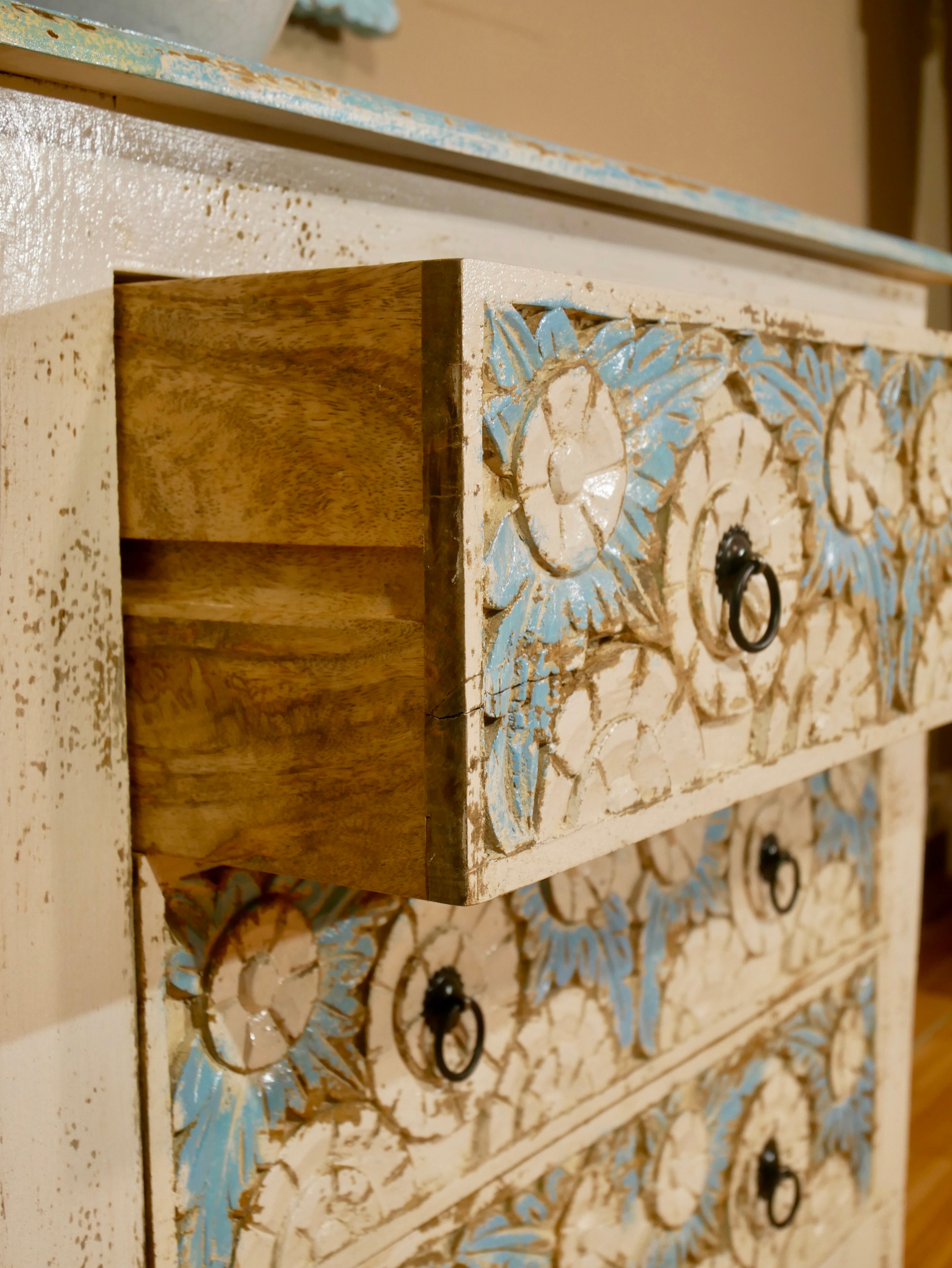 Boho style carved drawer chest made from solid mango wood with floral hand-carved details, Mediterranean design, 80 × 75 × 35 cm.