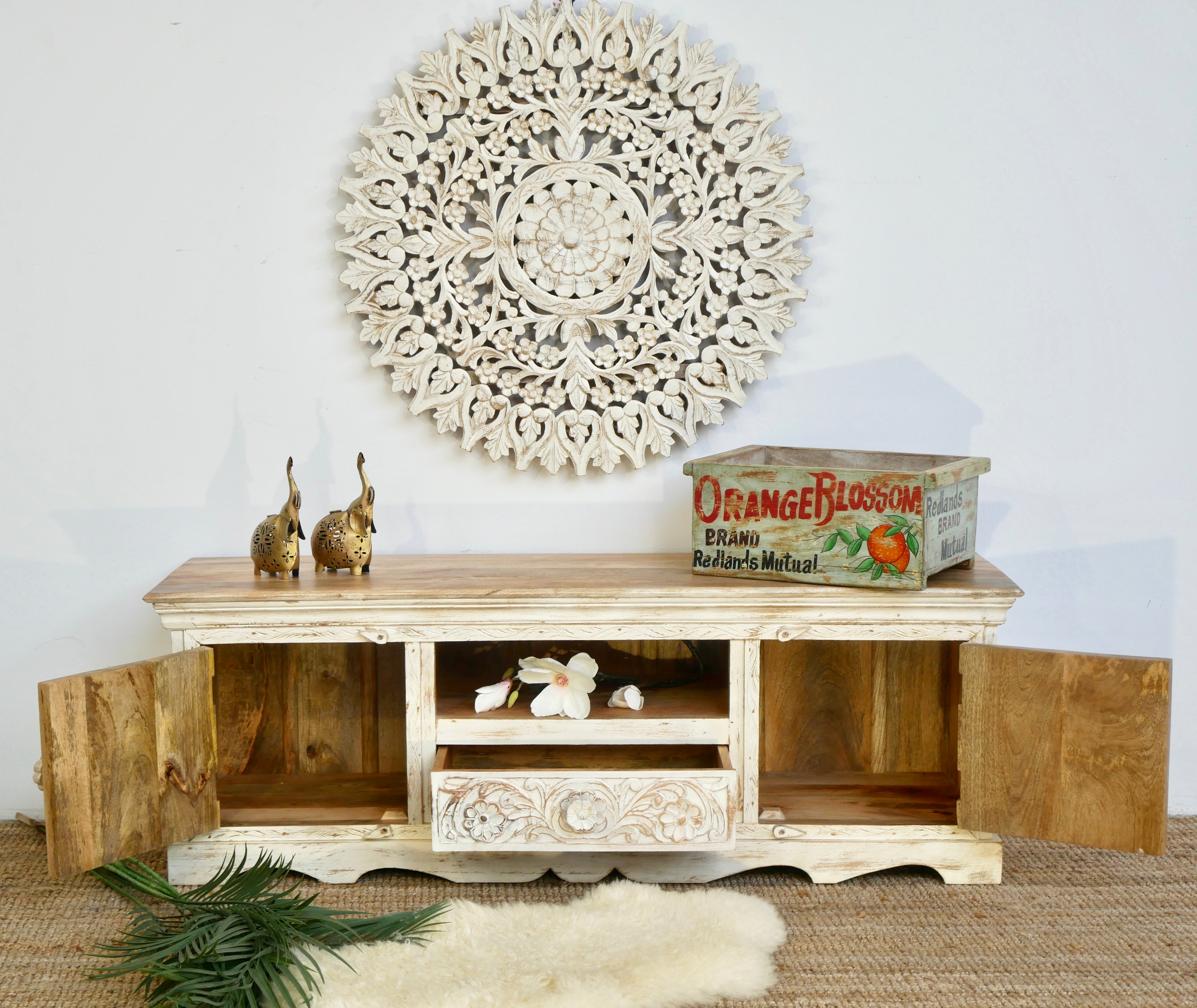 Open door image of a handcrafted wooden carved sideboard made from mango wood with Indian carvings and drawers; ideal living room furniture, 150 × 60 × 40 cm.