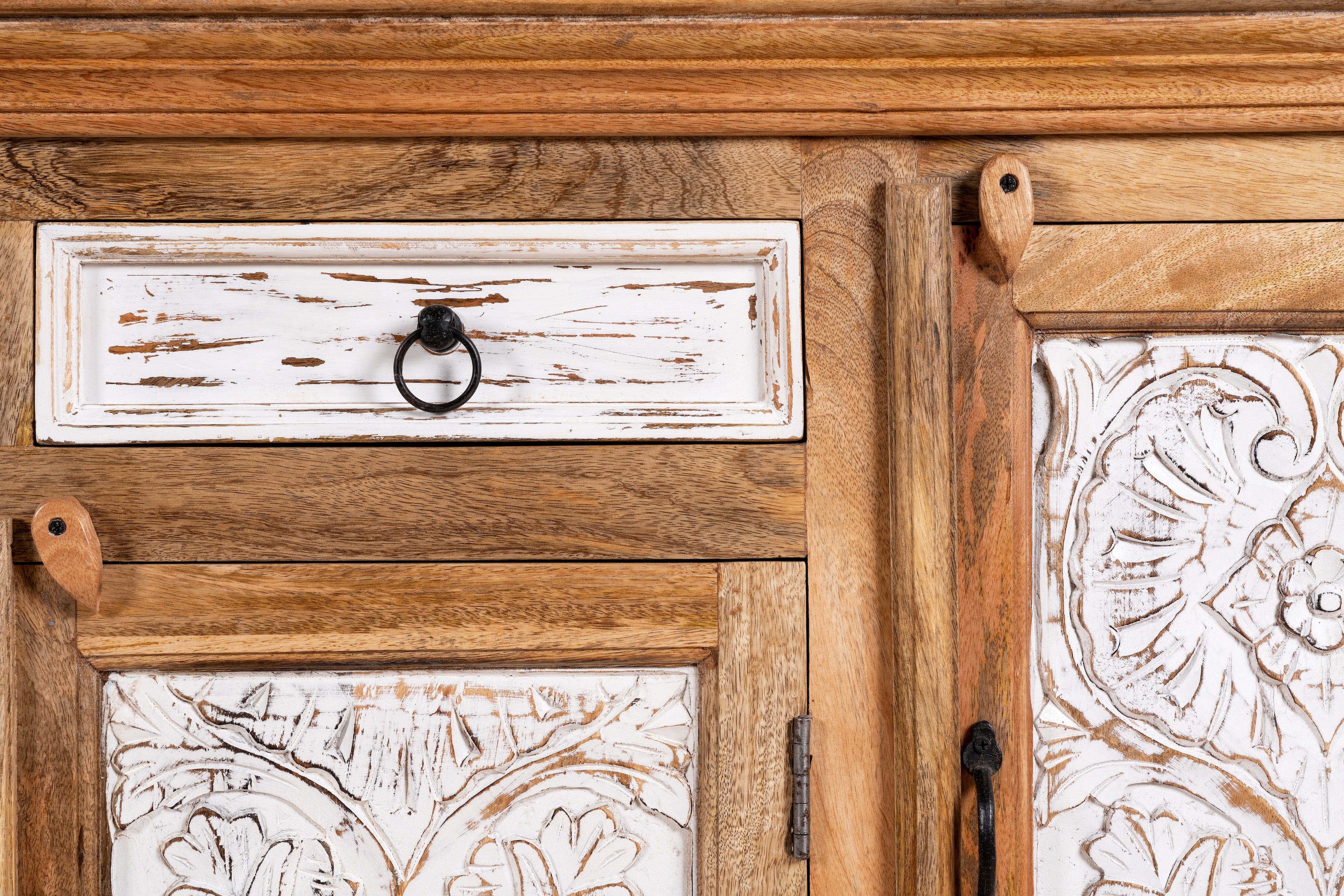 Close up image of a Talaja handcrafted solid mango wood sideboard with intricately hand-carved doors, natural wood grain, traditional Indian patterns, and spacious storage, 180cm.