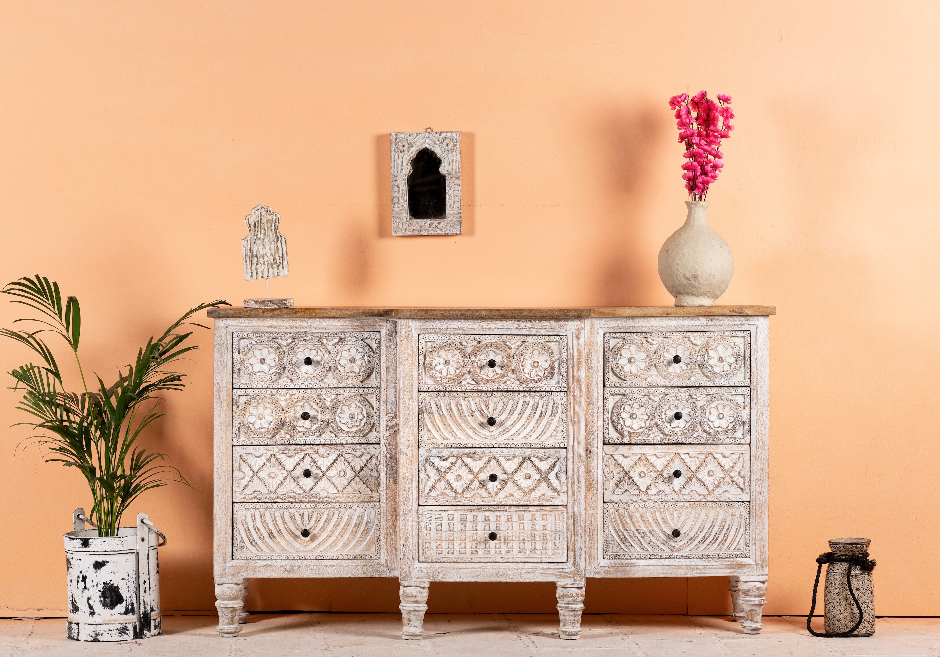 Hand-carved mango wood sideboard with lotus-inspired drawer motifs and whitewashed finish; a wood carved sideboard and unique furniture piece, 160 × 92 × 45 cm.