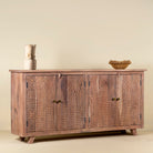 Side angle image of a acacia wood cabinet with hand-carved geometric patterns, artisan carved wood furniture for living room storage, 180 × 40 × 90 cm.