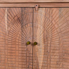 Close up image of a Acacia wood cabinet with hand-carved geometric patterns, artisan carved wood furniture for living room storage, 180 × 40 × 90 cm.