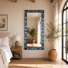 Lifestyle image of a Aagam hand painted reclaimed wood vintage wall mirror with blue floral frame, 180x90cm