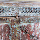 Close up image of a antique Indian Door Wardrobe with generated colours and iron fittings in vintage style made of teak wood.