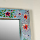 Close up image of a Aakar hand painted reclaimed wood vintage wall mirror with colourful floral frame, 180x90cm
