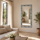 Lifestyle image of a Aakar hand painted reclaimed wood vintage wall mirror with colourful floral frame, 180x90cm