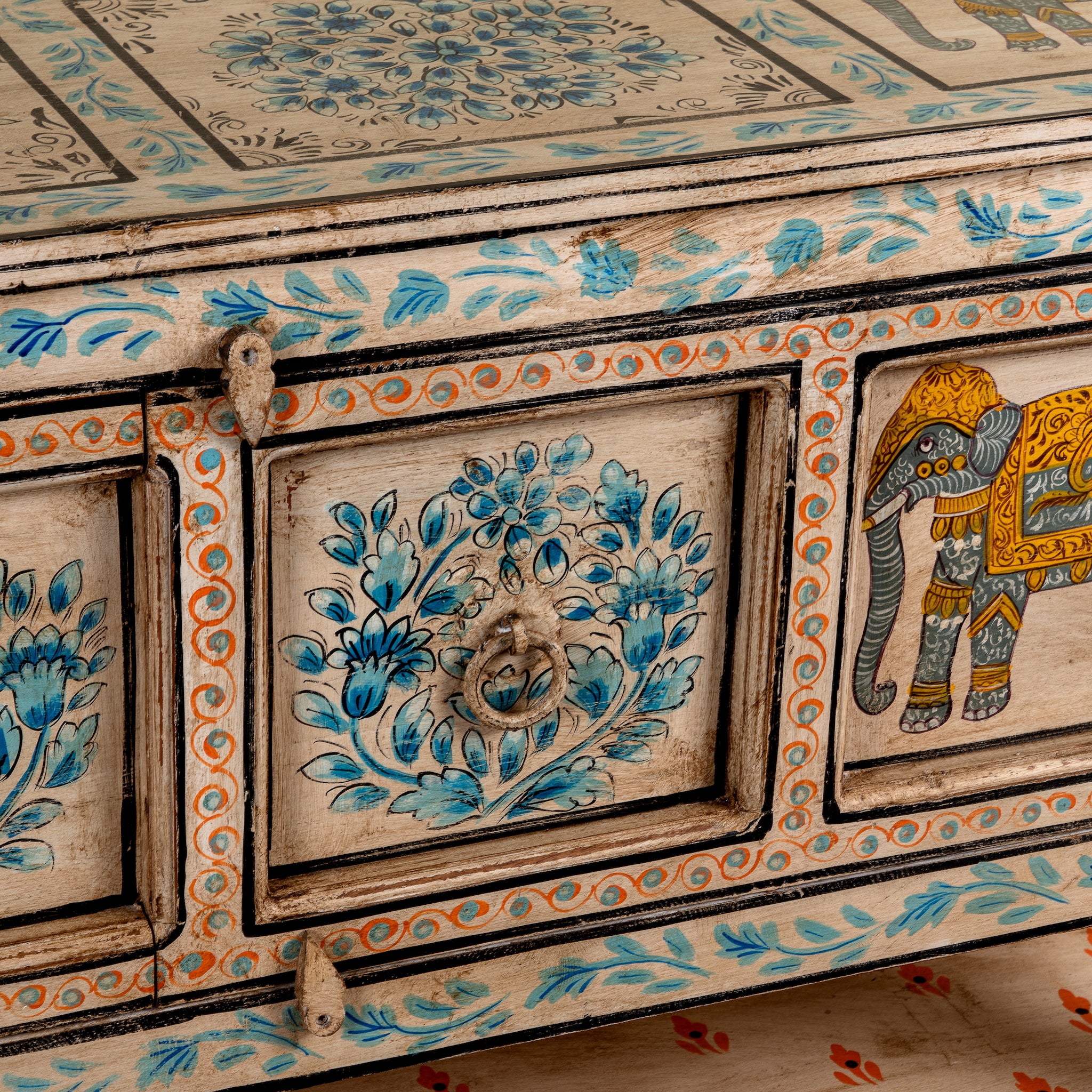 Close up image of a Aakash hand painted reclaimed wood console table with blue floral and elephant motifs, storage and open shelf 114cm